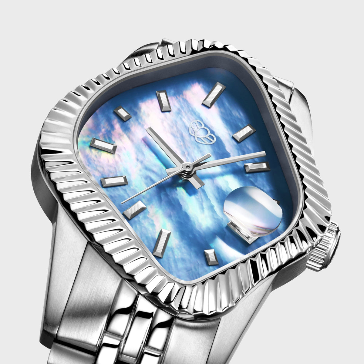 LAARVEE Silver Precision Steel watch with fluted bezel and light blue mother of pearl dial, close-up angled dial view