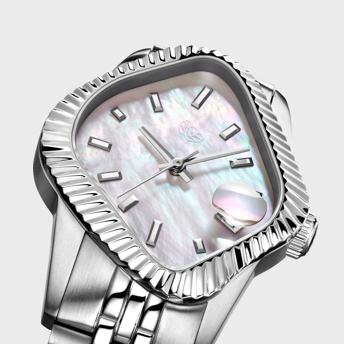 LAARVEE Silver Precision Steel watch with fluted bezel and white mother of pearl dial, close-up angled dial view