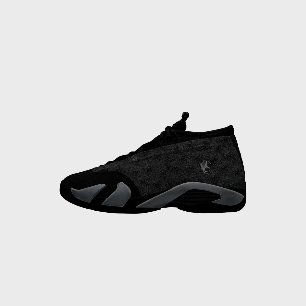 Air Jordan 14 Low Black / Off Noir, medial side profile in black with Jumpman shield badge and grey outsole accents