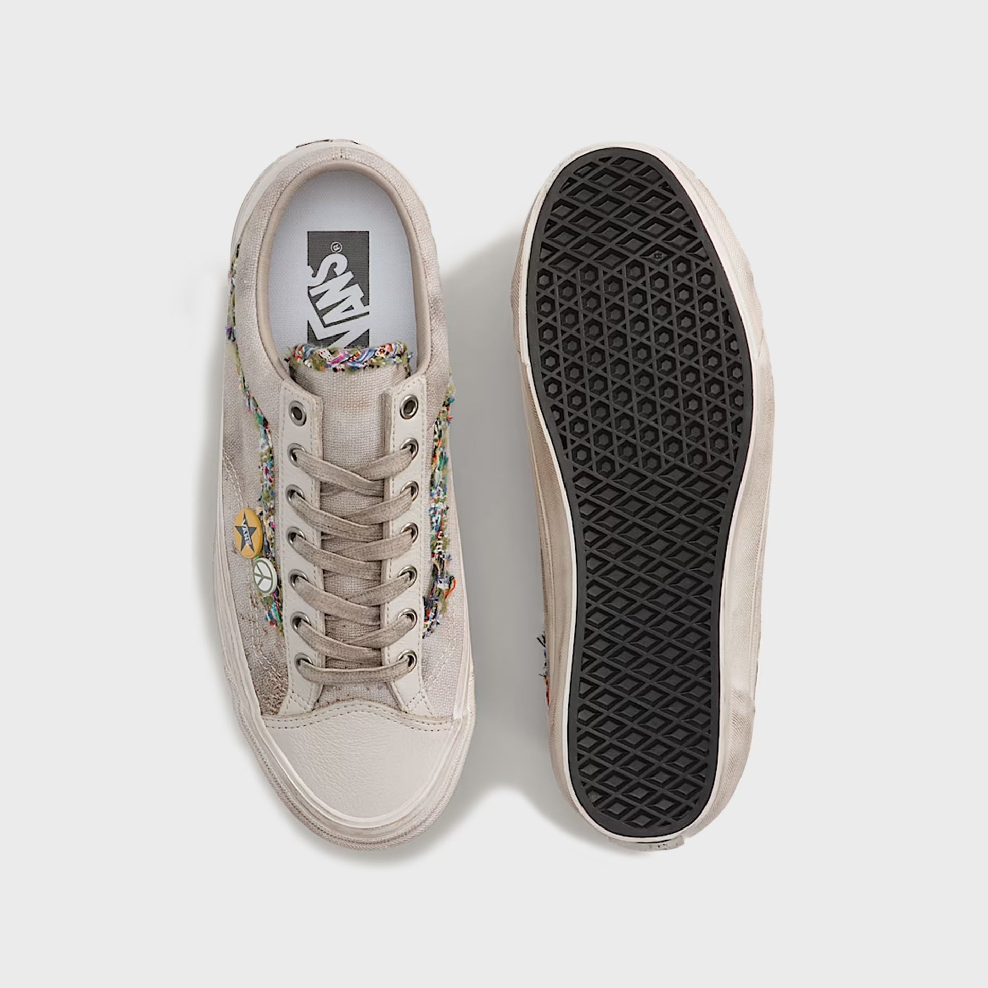 Vans LX Old Skool 36 overhead view: one sneaker showing the Vans footbed, the other flipped to reveal the black waffle outsole