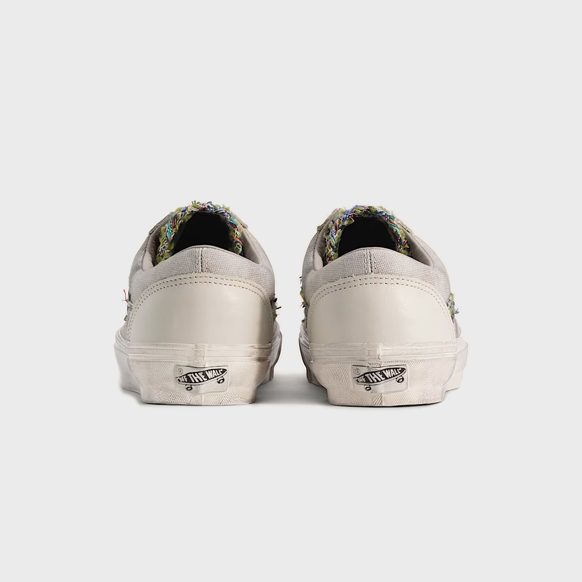Vans LX Old Skool 36 in oatmeal beige, rear heel view of the pair showing white "Off The Wall" back tab labels
