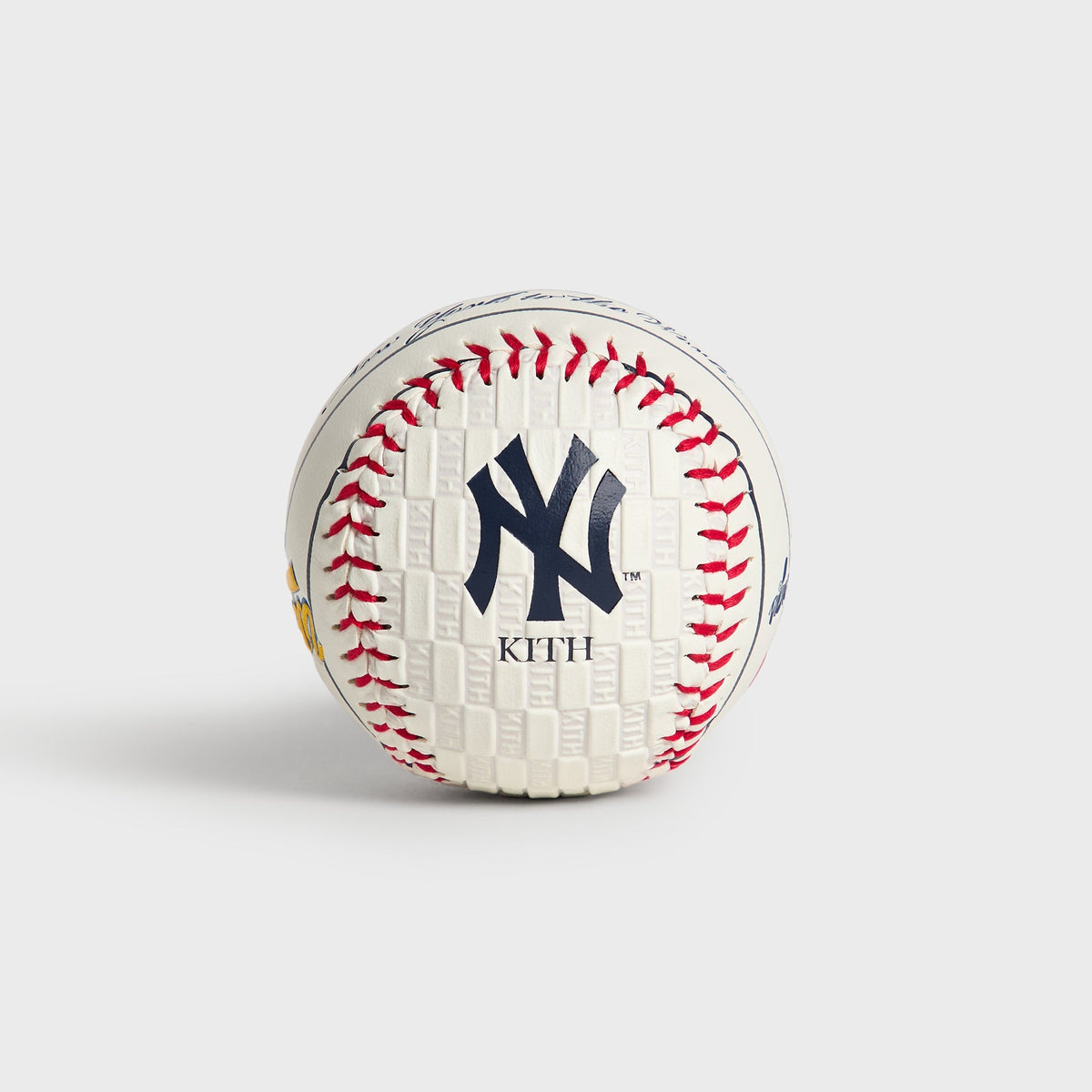 Kith & Rawlings Commemorative Baseball, Yankees - angled view showing embossed NY logo and Kith wordmark panel