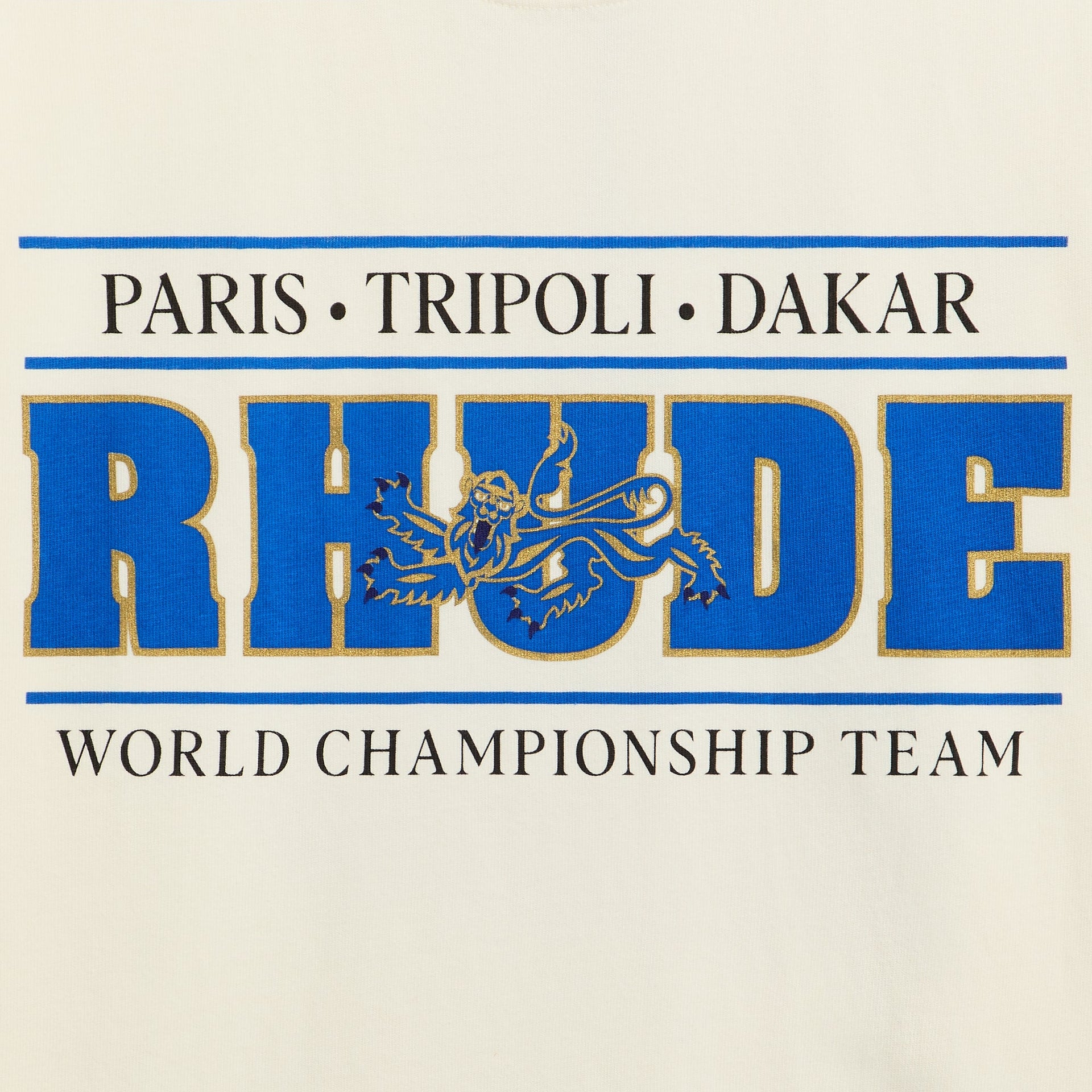 Rhude Chrono Tee detail, close-up of blue and gold RHUDE lion chest print, Paris Tripoli Dakar