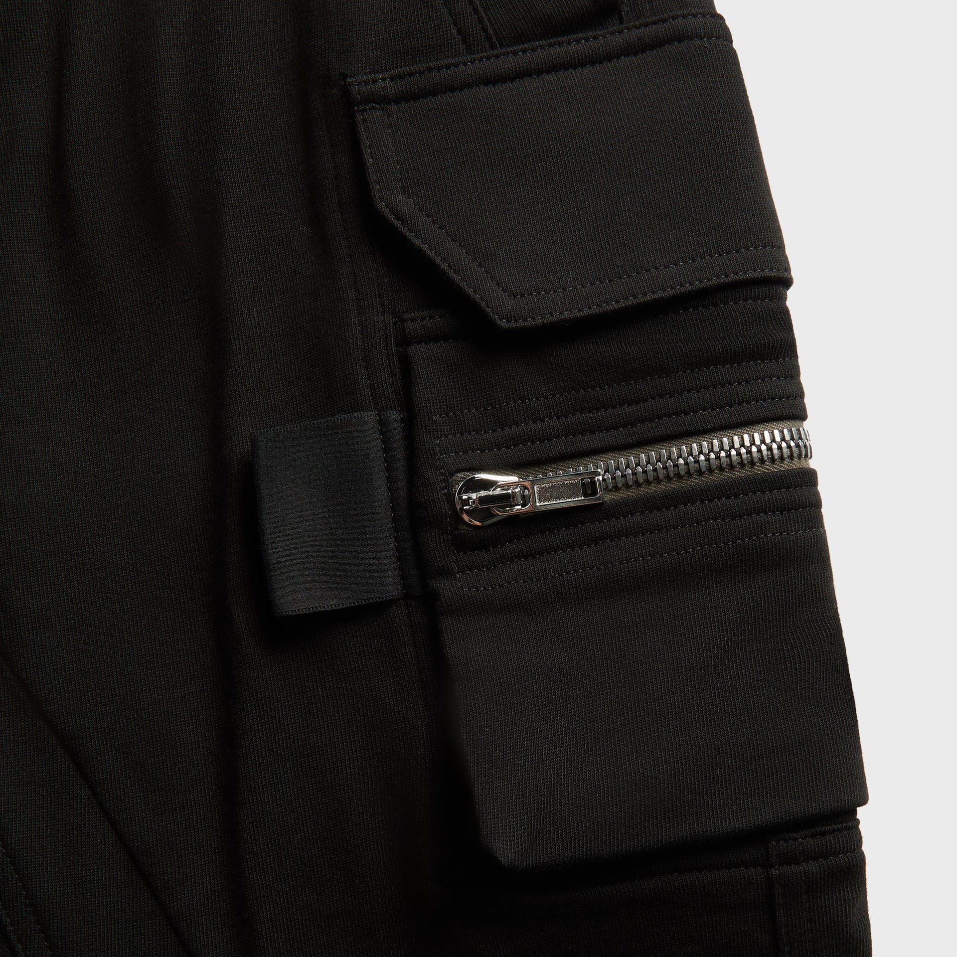 Stone Island detail, black back pocket with leather compass patch and buttons