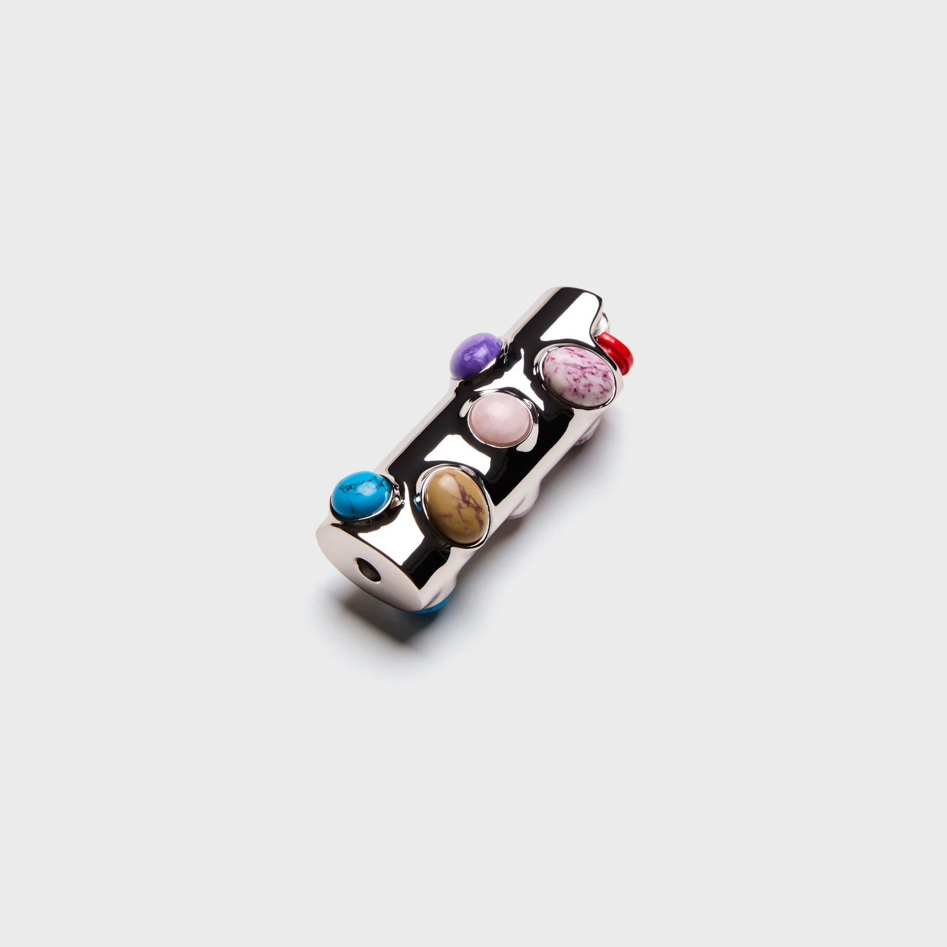 Edie Parker Stoned lighter case, polished chrome set with turquoise, purple and pink gemstone cabochons, angled view