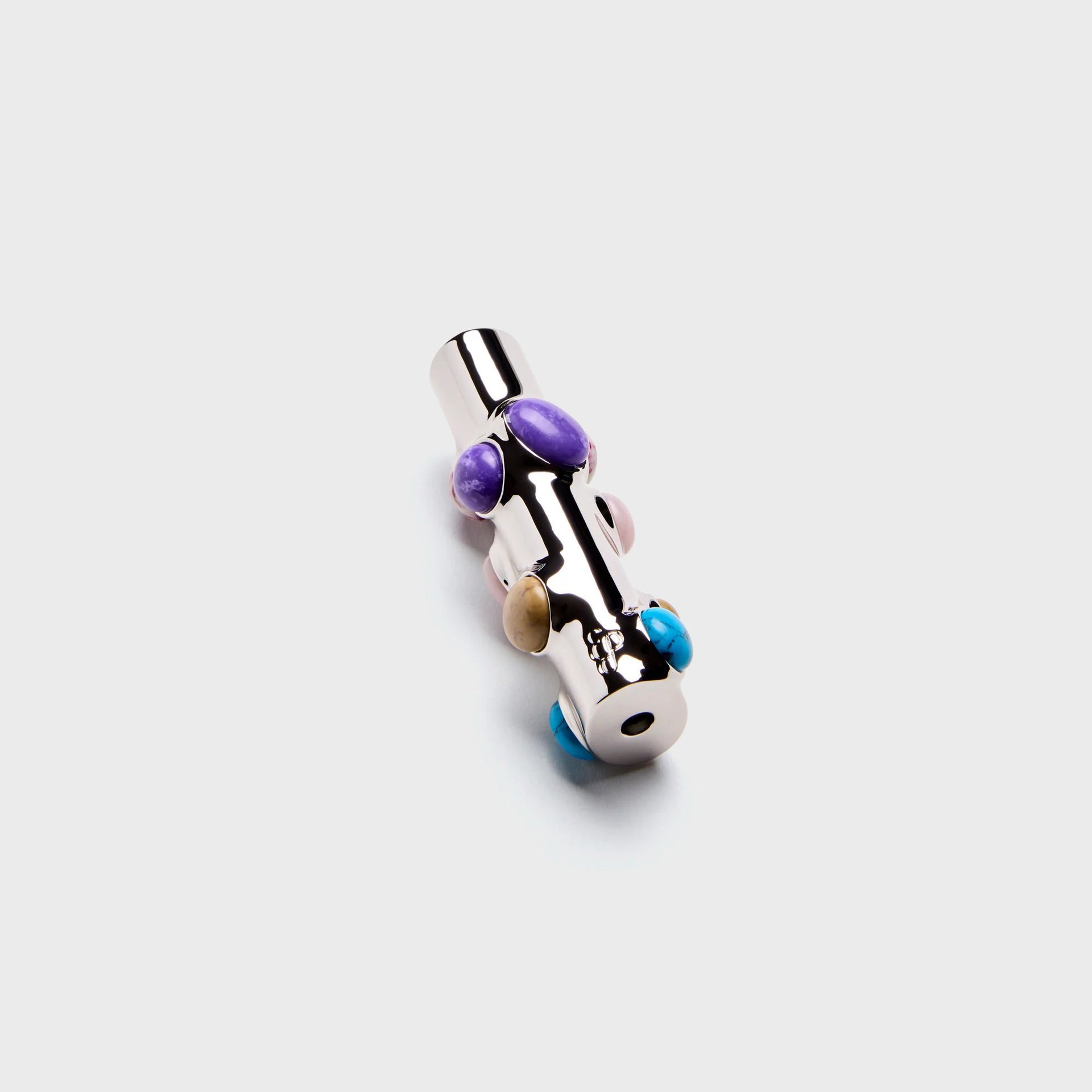 Edie Parker Stoned chrome lighter case upright, end view with base opening and purple and turquoise stones