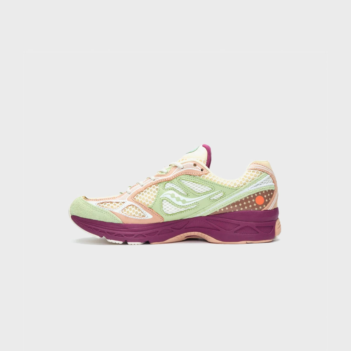 Saucony x Stan Birch ProGrid Guide 7 sneaker inner side view showing cream, sage and peach mesh paneling