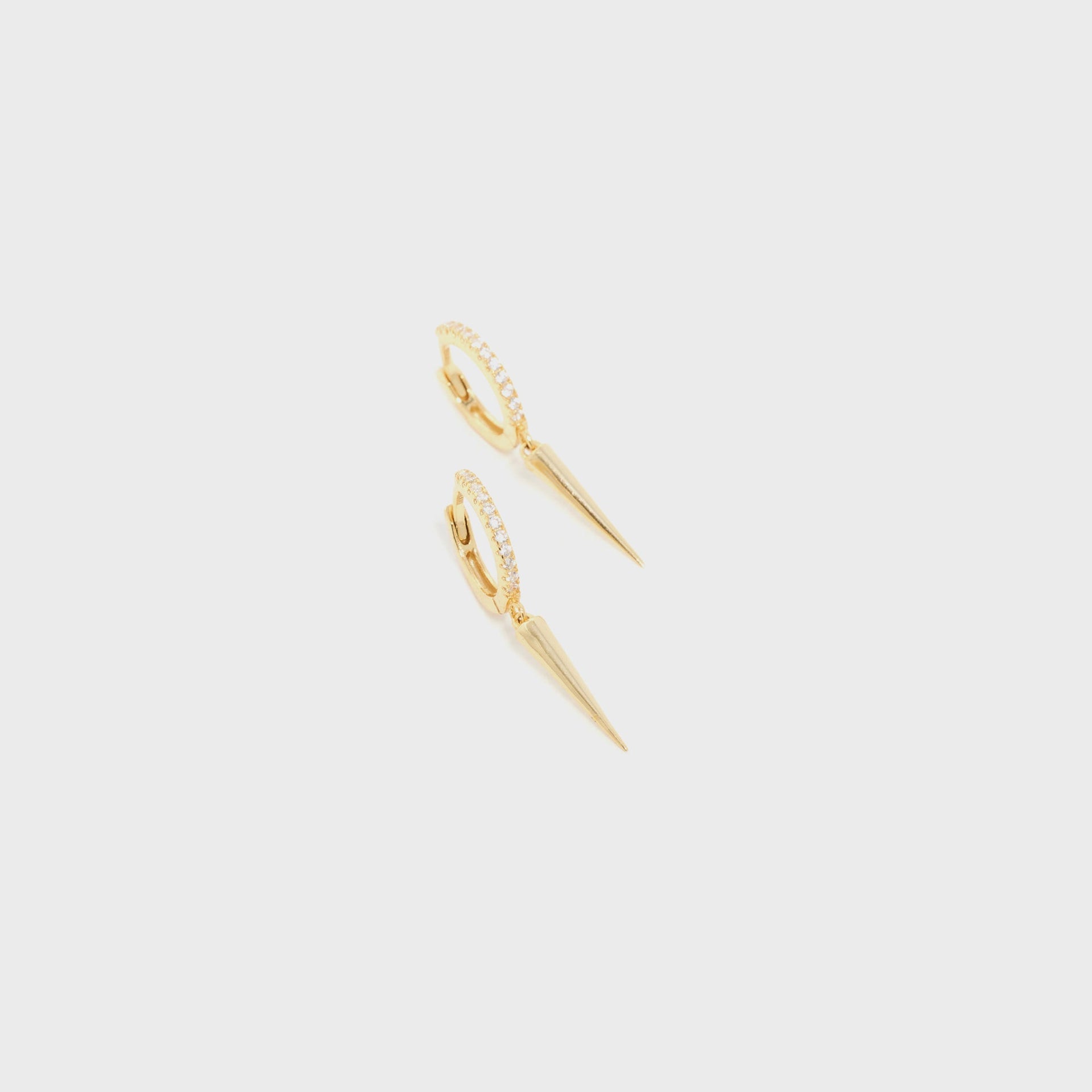 SHASHI Dagger Huggie in Yellow Gold