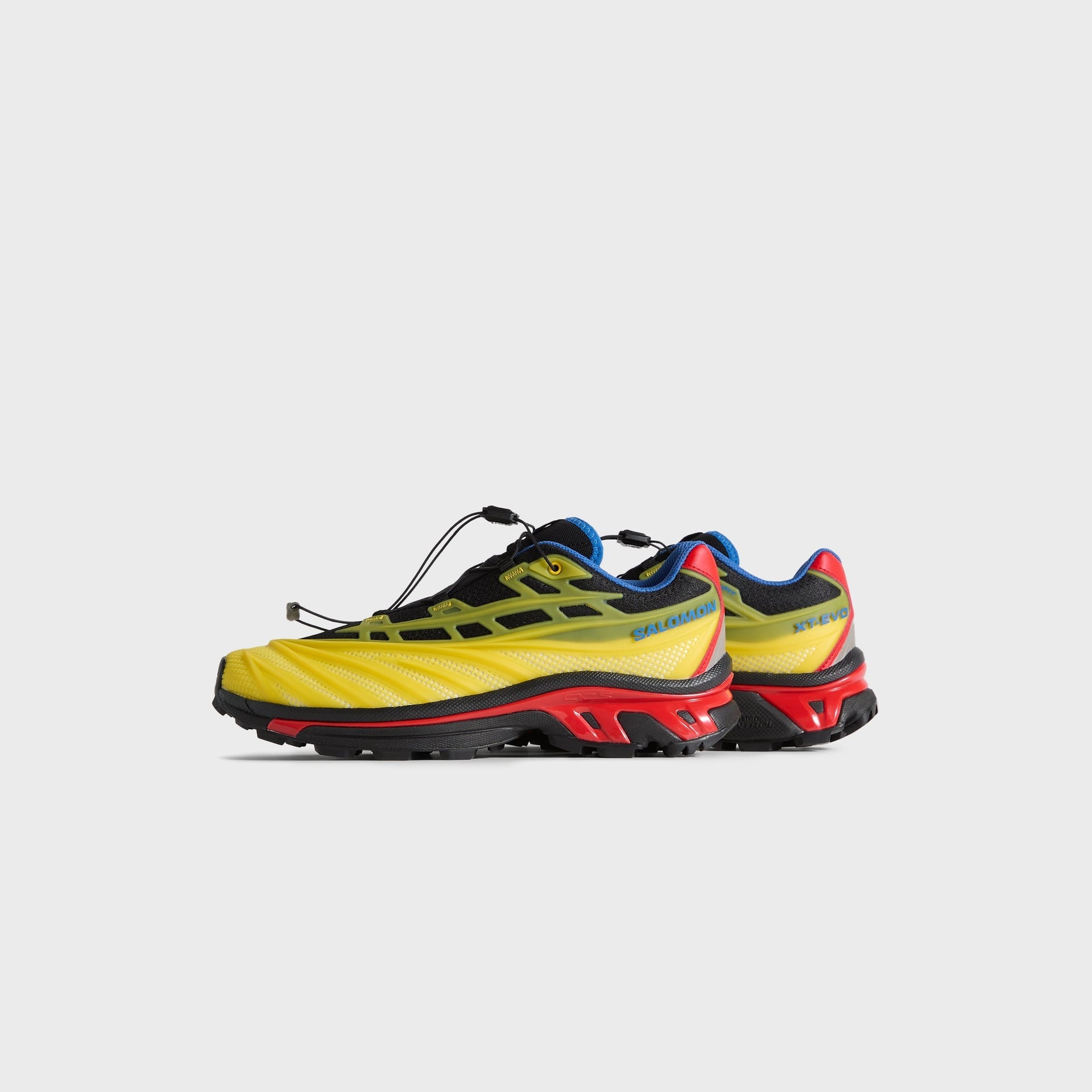 Kith for Salomon XT-EVO, medial side profile of the pair in the Black/Lemon/Lava Falls colorway