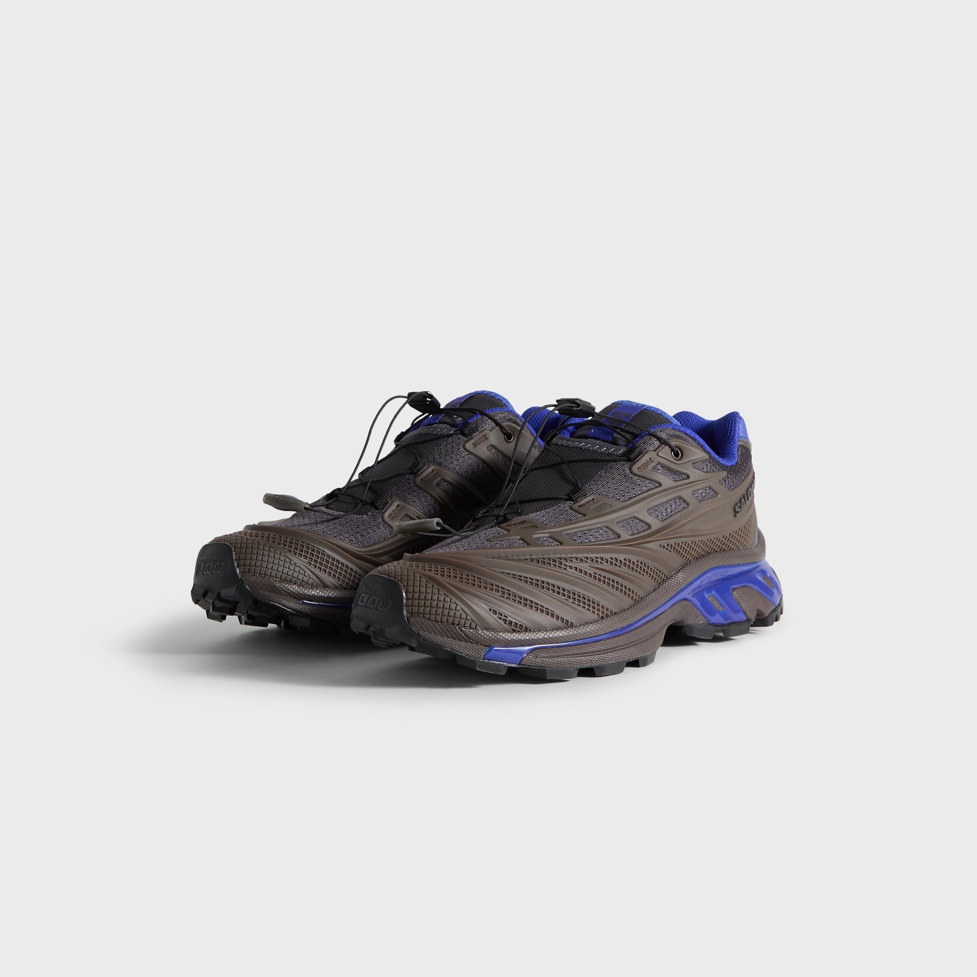 Kith for Salomon XT-EVO sneakers, front three-quarter view of pair, brown upper and blue Contagrip midsole