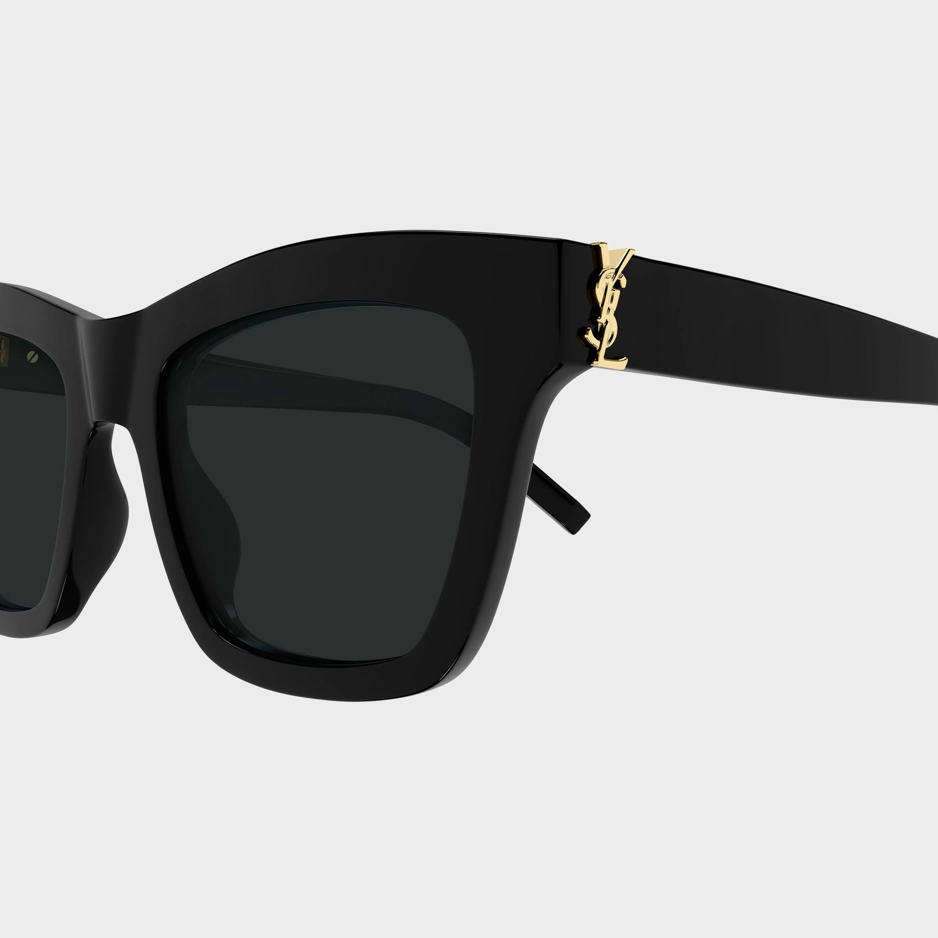Saint Laurent SLM156 cat-eye sunglasses in black, close-up of gold YSL monogram at temple hinge