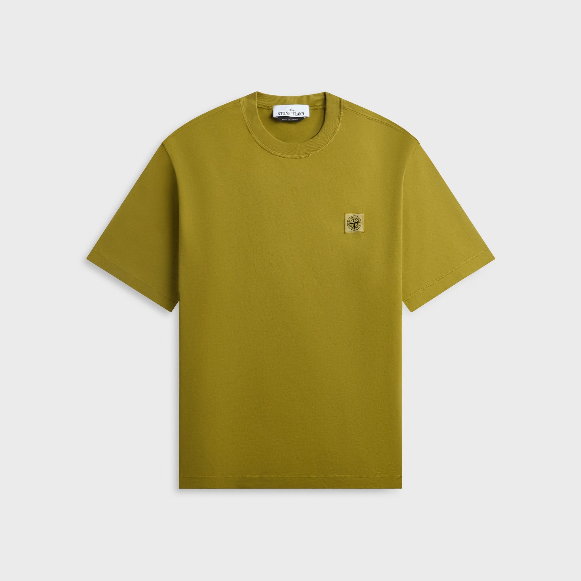 Stone Island cotton tee in cactus mustard-yellow, front view with square compass patch on chest