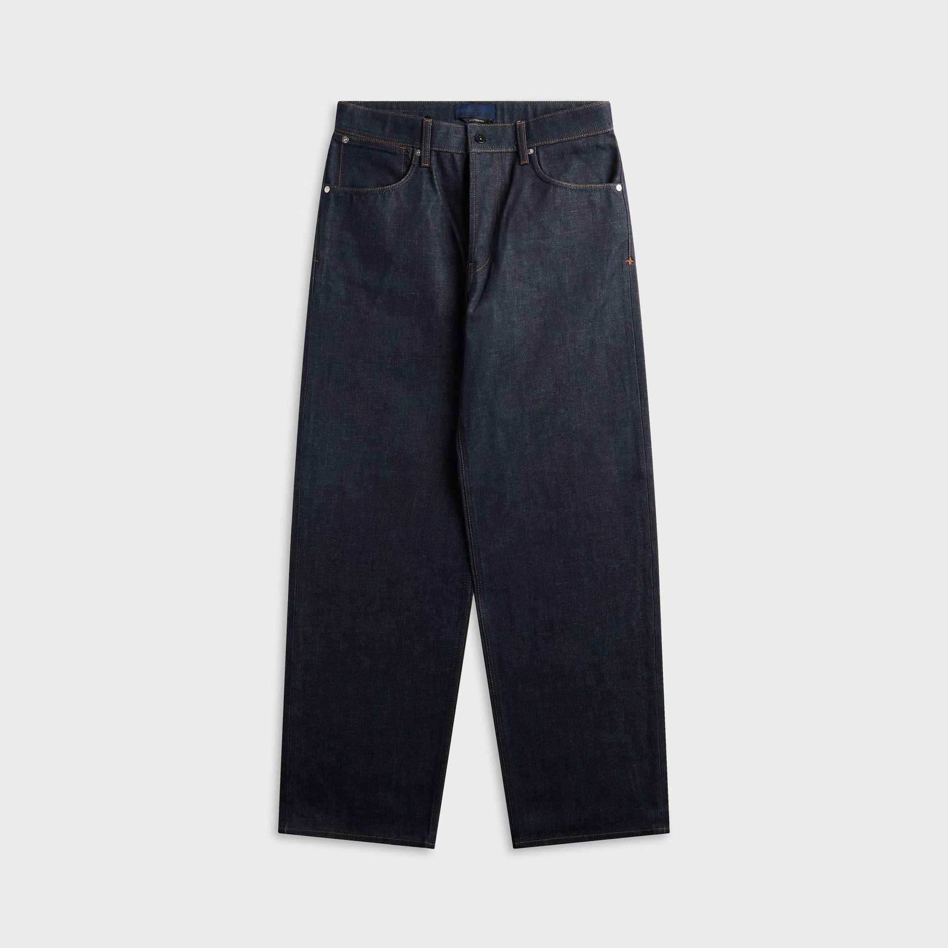 Stone Island indigo raw denim loose-fit jean, front view, five-pocket with orange contrast stitching