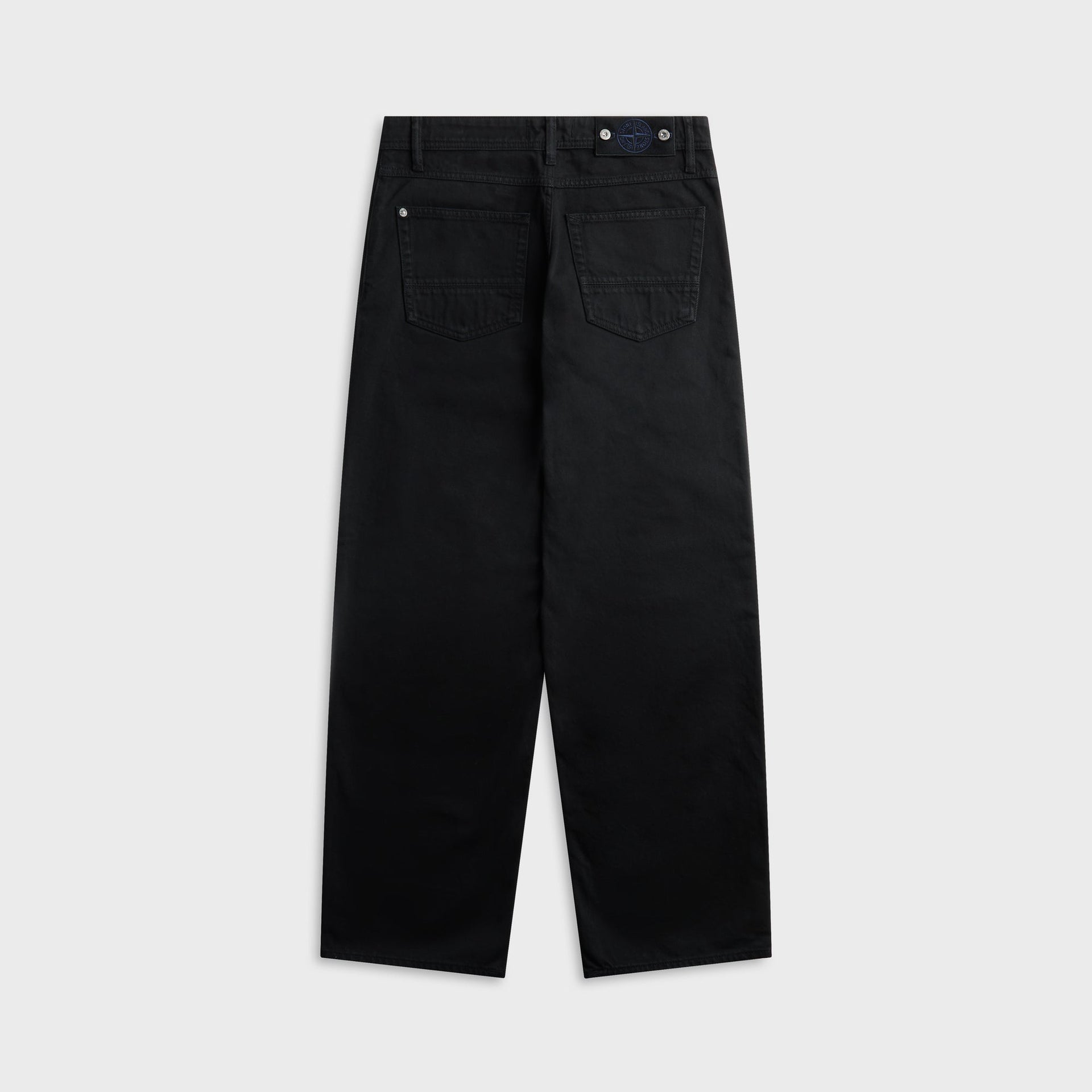 Black Stone Island bull denim loose-fit jean, back view with patch pockets and leather waistband tab