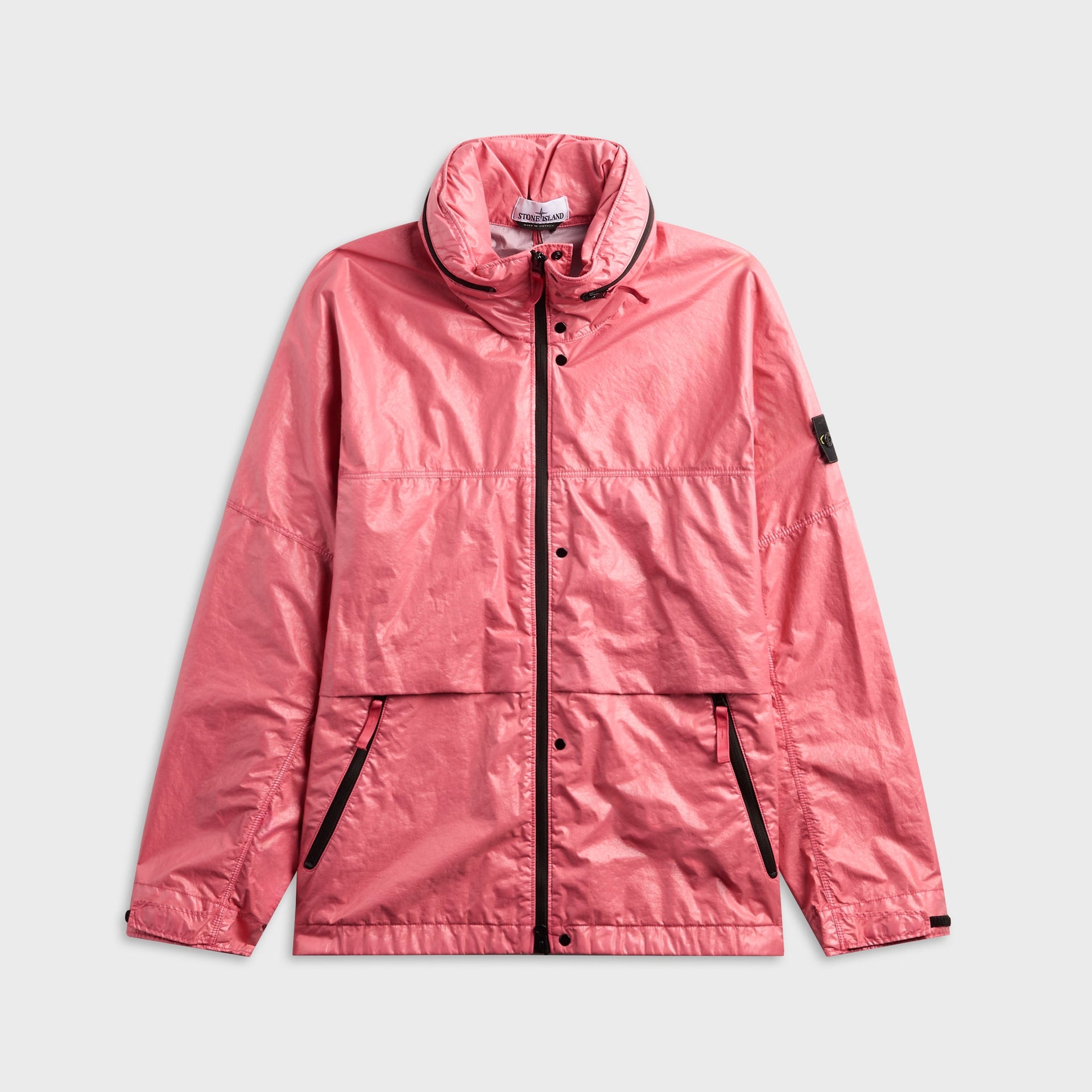 Stone Island light nylon 3L hooded jacket in geranium pink, front view with black center zip and sleeve badge