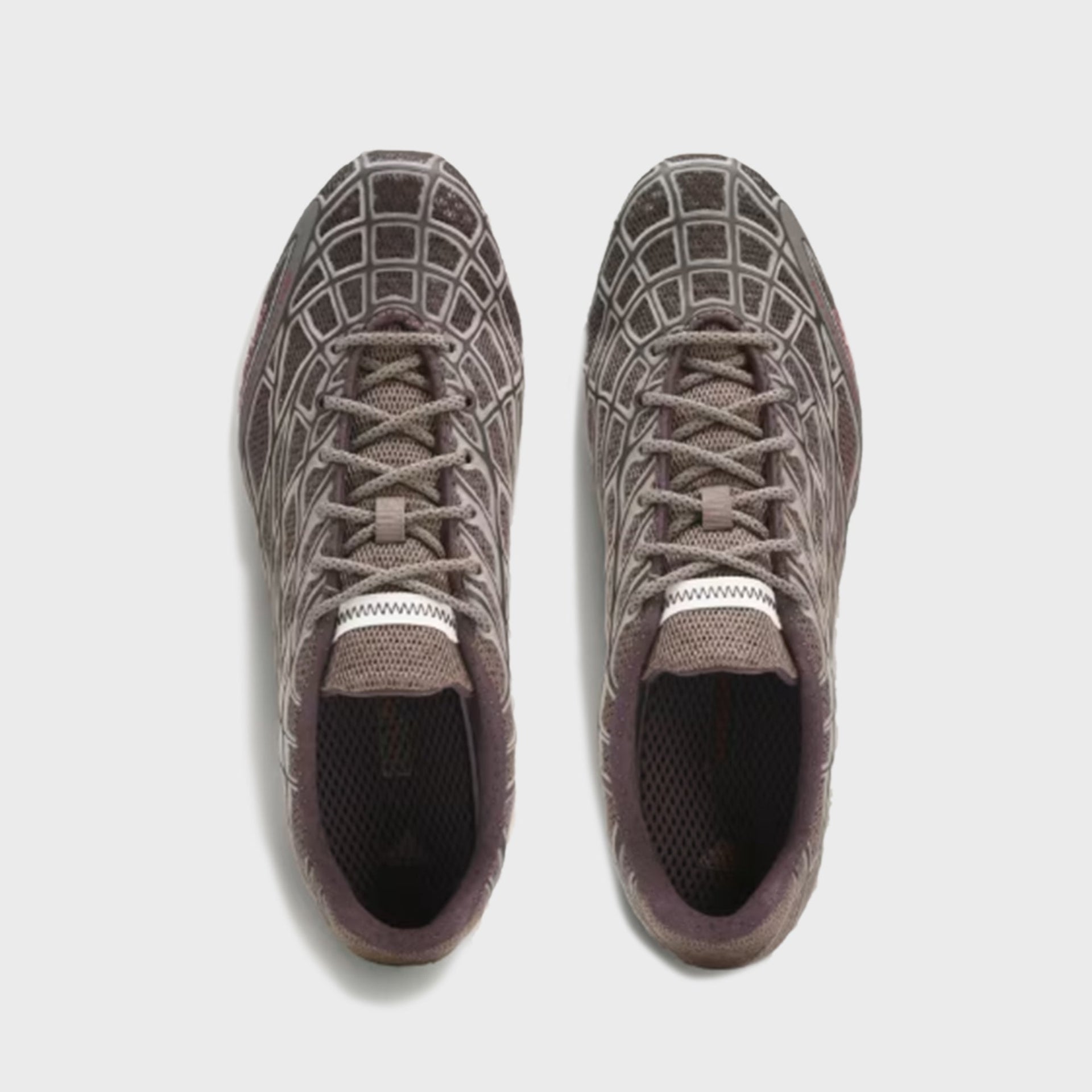 Top-down view of adidas x Bad Bunny F50 Ghost Sprint sneakers showing crisscross laces and mesh diamond pattern