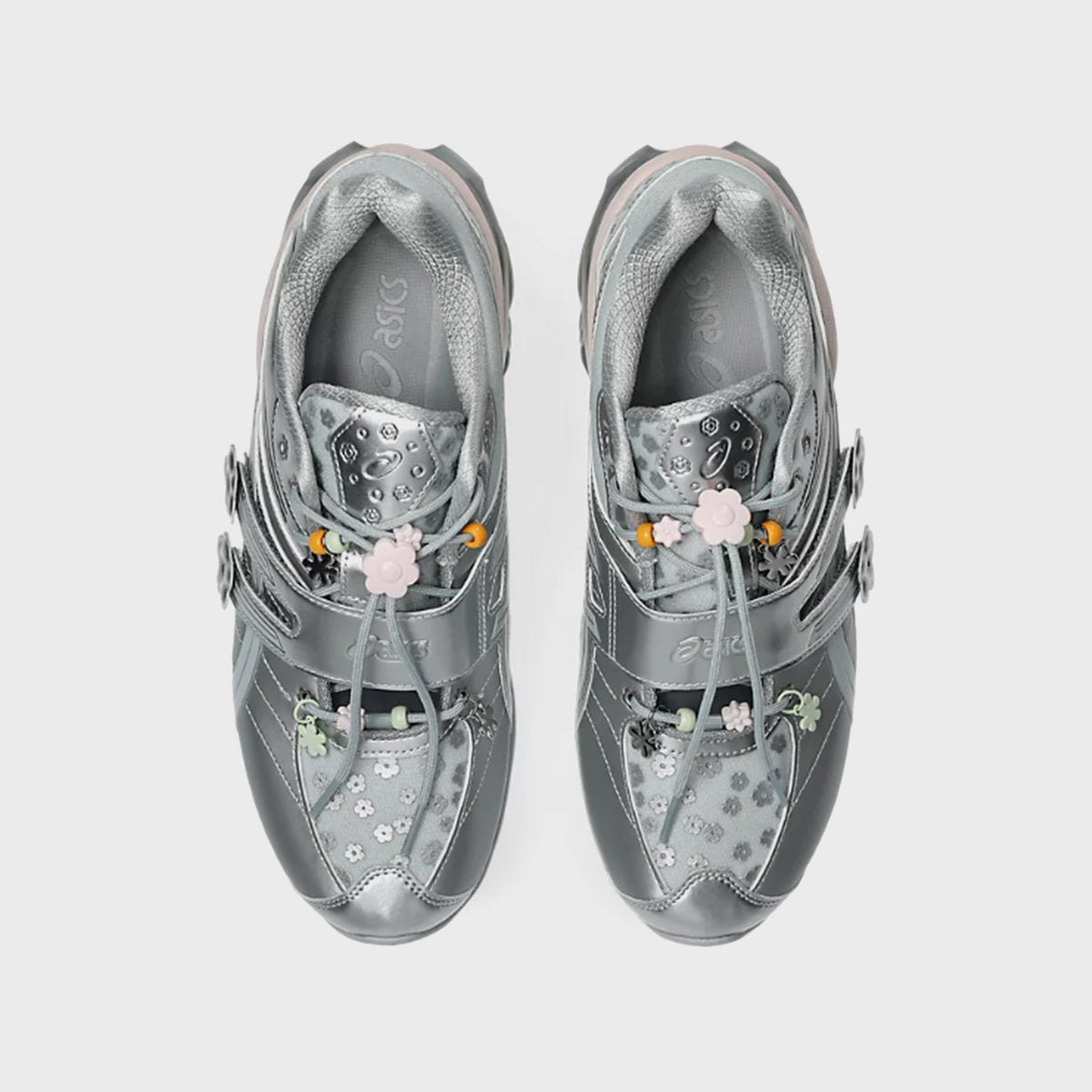 Top-down view of ASICS x Cecilie Bahnsen GEL-KINETIC FR pair showing floral print tongue and silver ASICS branded insole