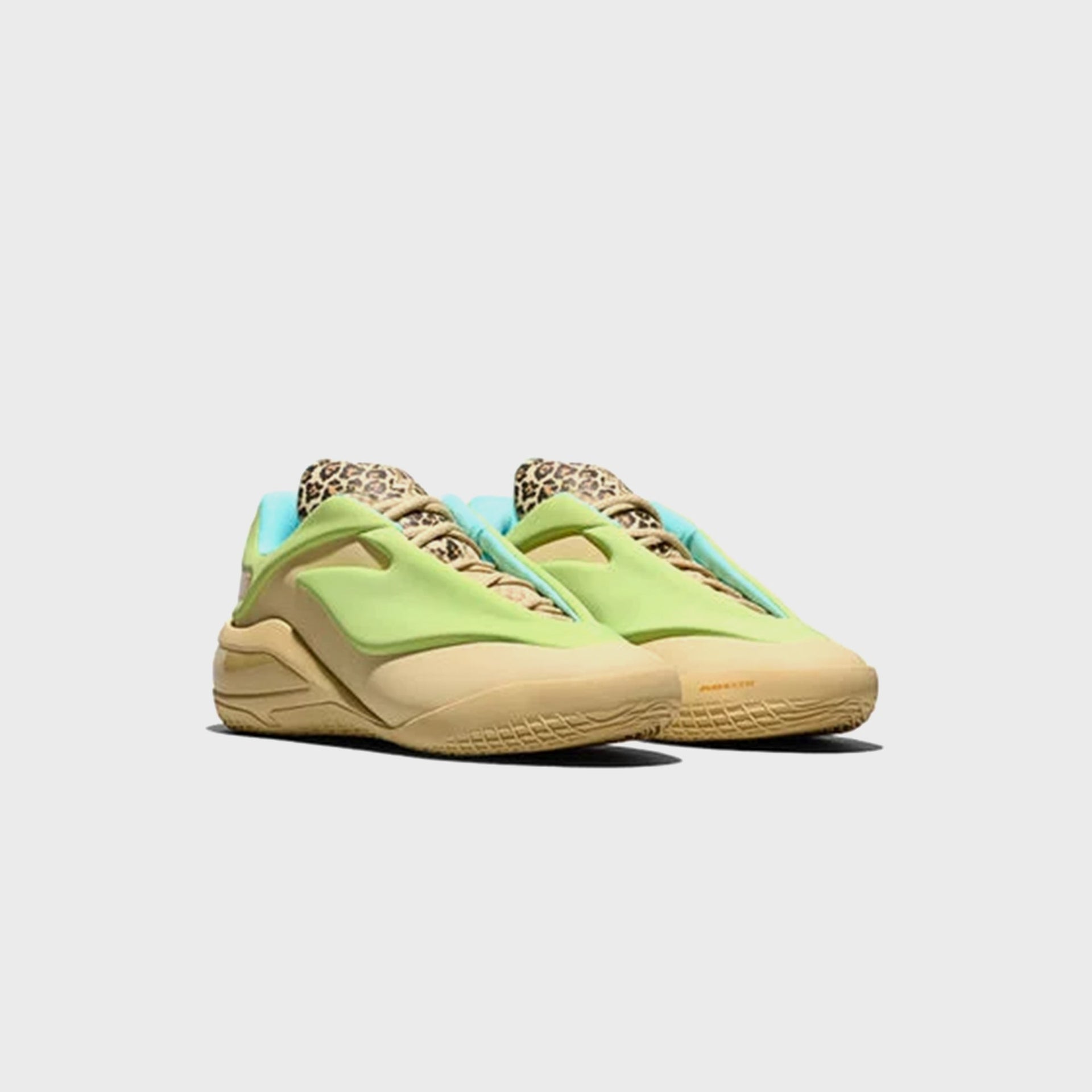 Converse SHAI 001 basketball sneaker in tan with lime green overlay, front three-quarter view of pair