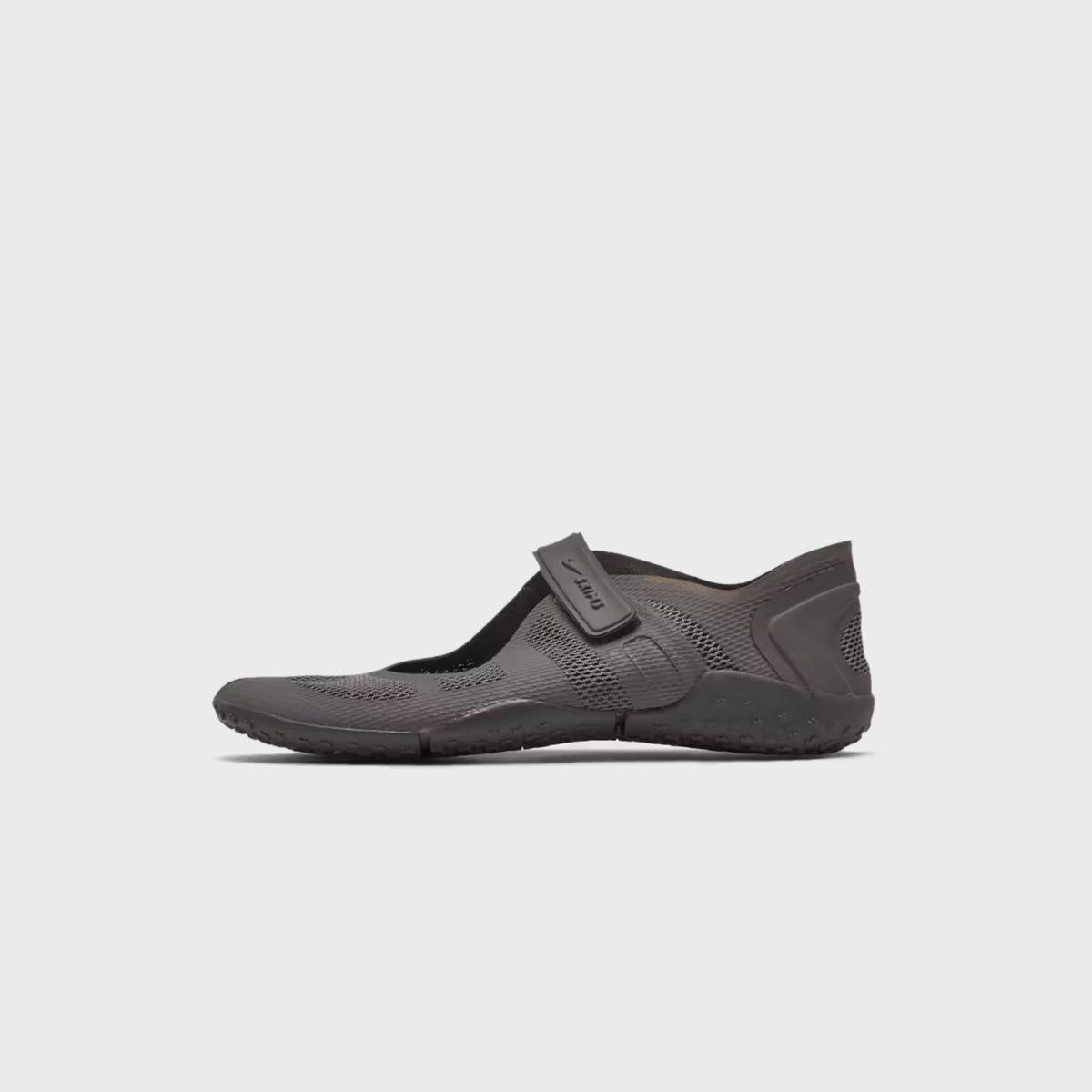 NikeSKIMS Rift 2 Tone Mesh sneaker in Cave Stone, side view highlighting the adjustable strap over the mesh upper