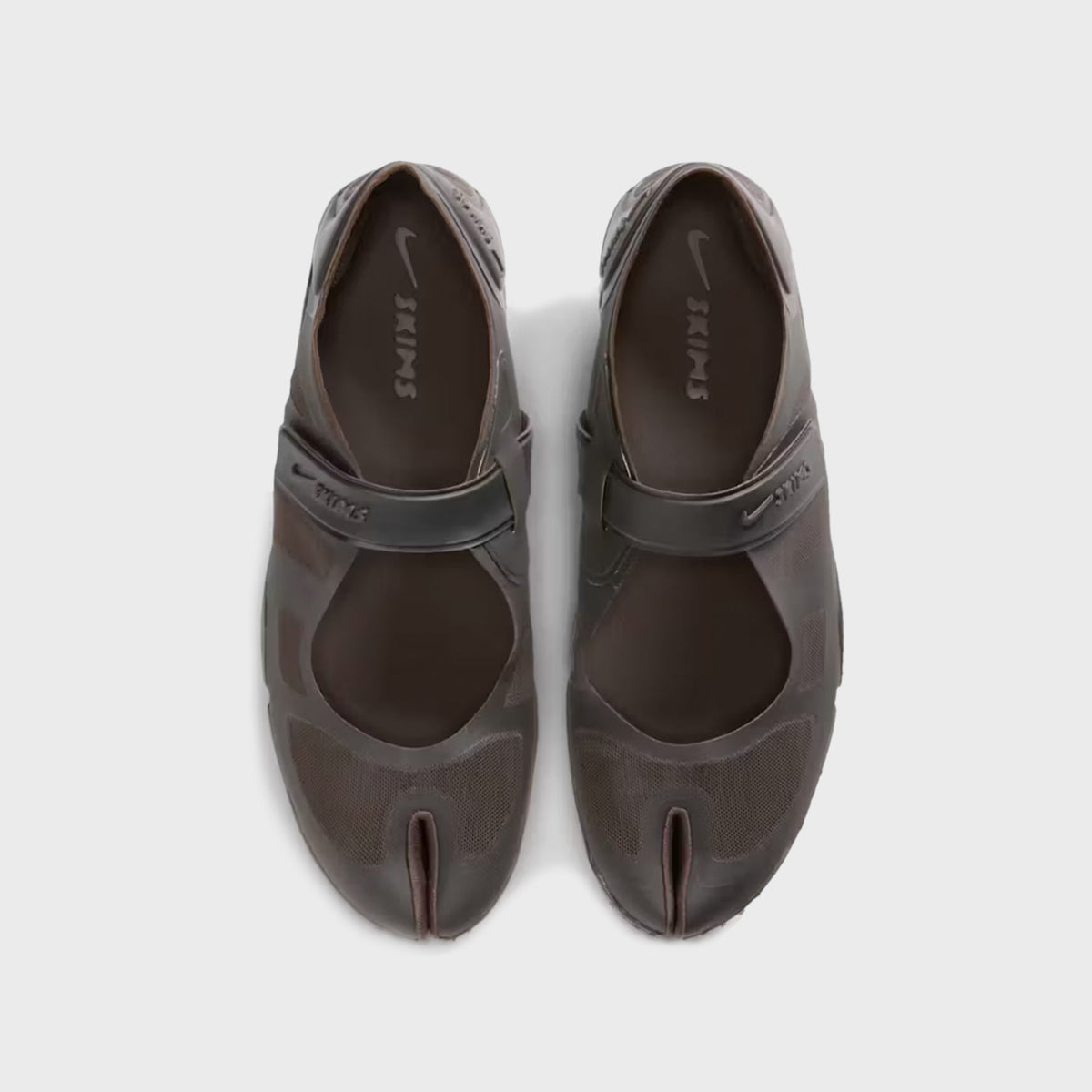 NikeSKIMS Rift 2 Tone Mesh sneakers in Cave Stone, top-down view showing the split-toe design and SKIMS branded insole
