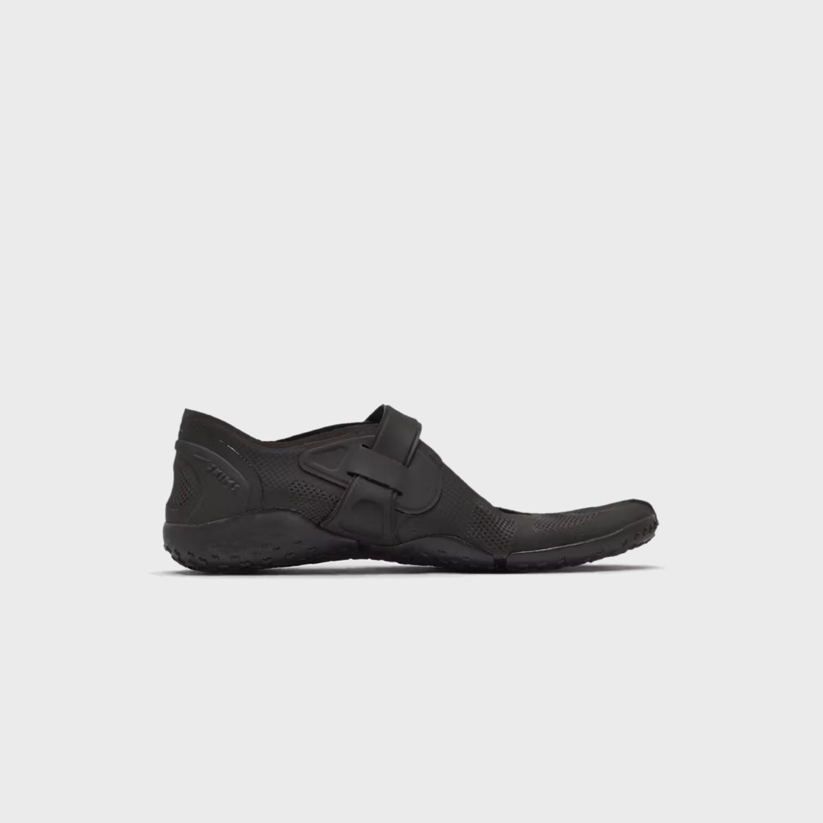 NikeSKIMS Rift 2 Tone Mesh sneaker in Tar Black, lateral side view showing the split-toe silhouette and hook-and-loop strap