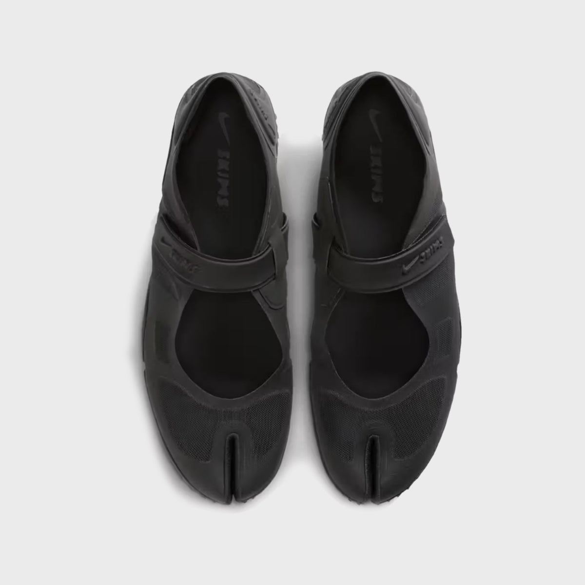 NikeSKIMS Rift 2 Tone Mesh sneakers in Tar Black, top-down view showing the split-toe design and SKIMS branded insole