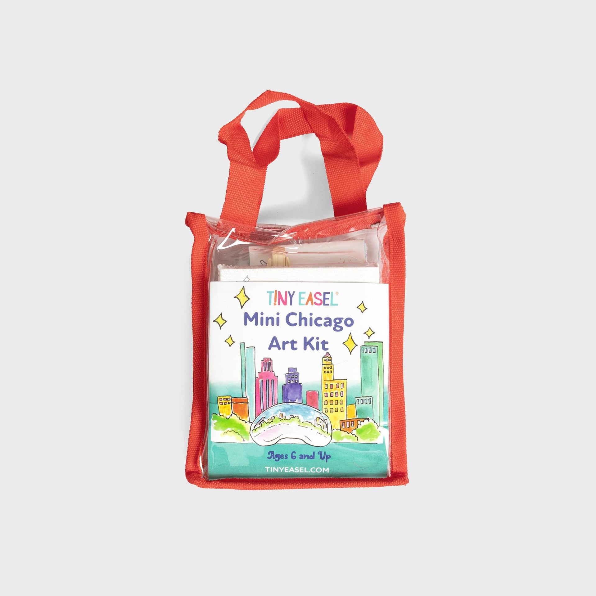 Tiny Easel Mini Chicago Art Kit in clear orange-trimmed tote, watercolor skyline with Cloud Gate bean, ages 6 and up