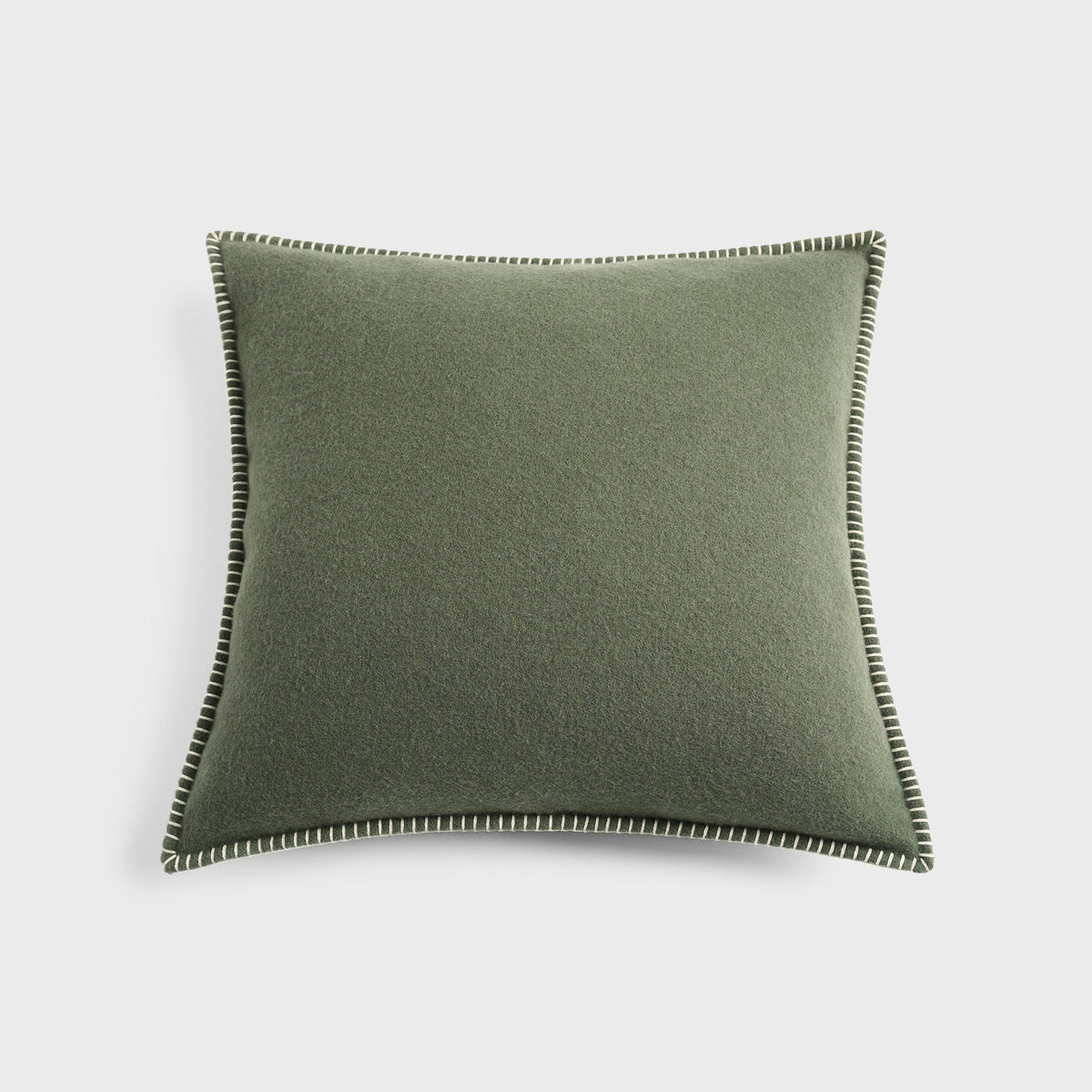 Tekla Lambswool Cushion in Willow, sage green wool cushion with whipstitched edge, full view