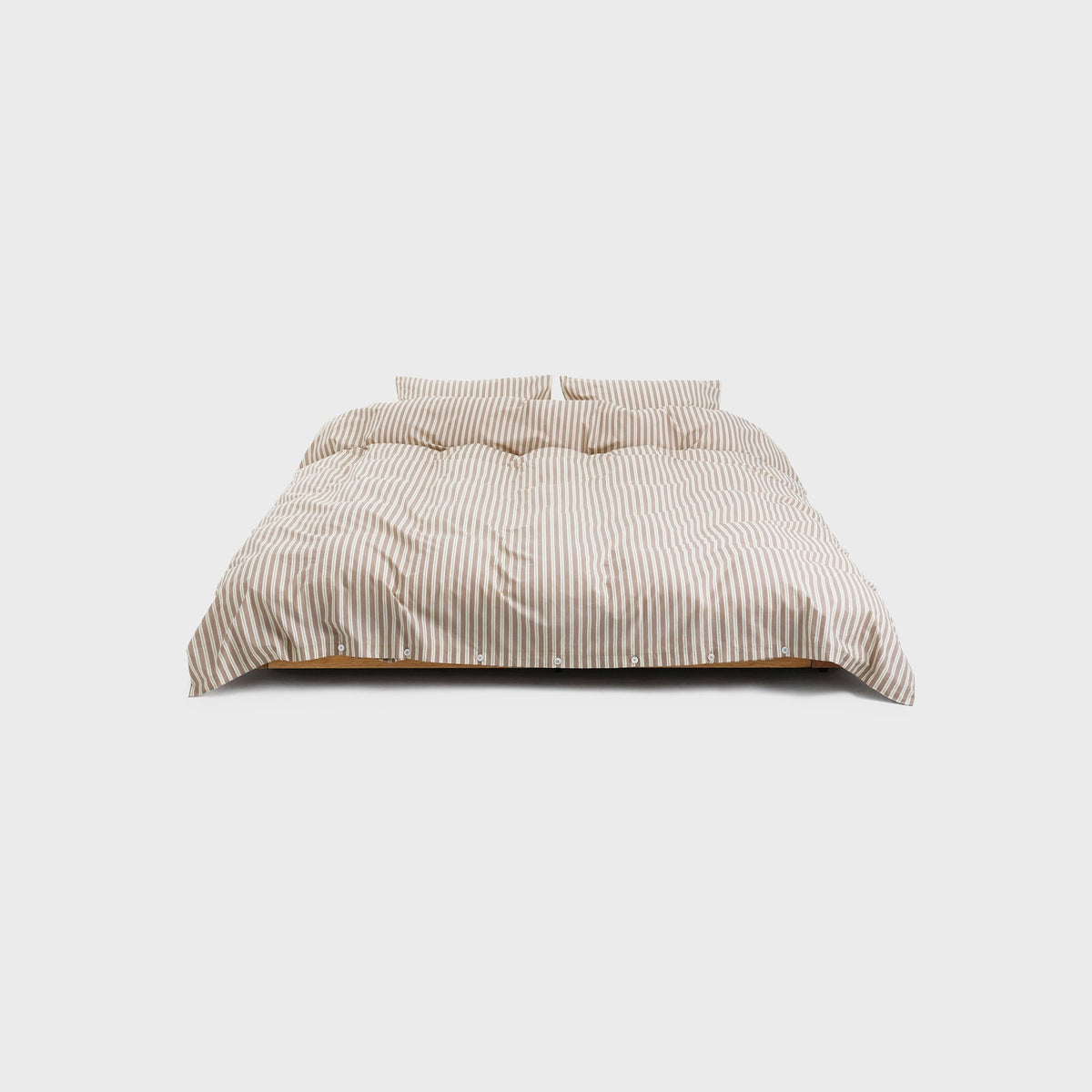 Tekla Percale Double Duvet Cover in Clay Stripes, duvet styled over a bed pillow