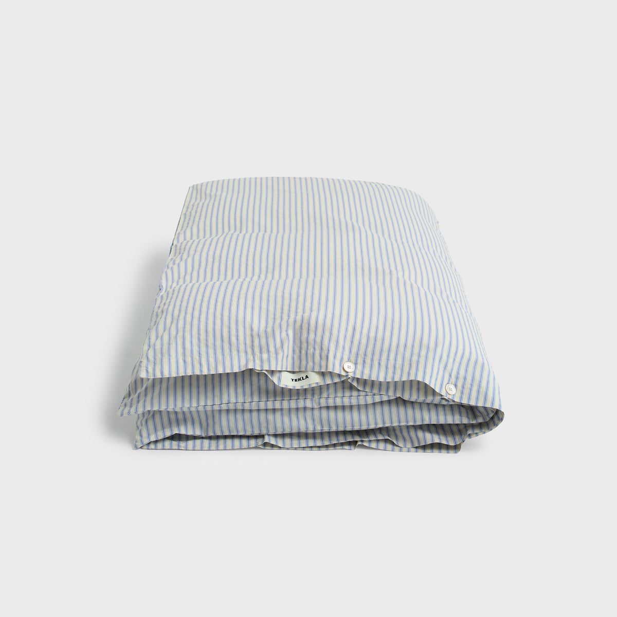 Tekla Percale Double Duvet Cover in Flint Stripes, folded light blue and white striped cotton fabric