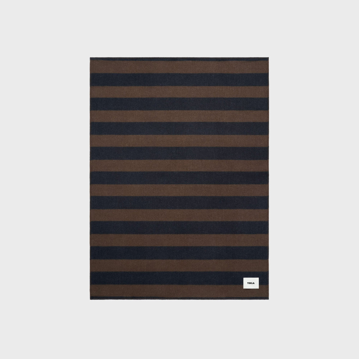 Tekla Lambswool Blanket in Walnut / Dusk Blue Stripes, close-up of the brown and navy striped wool fabric