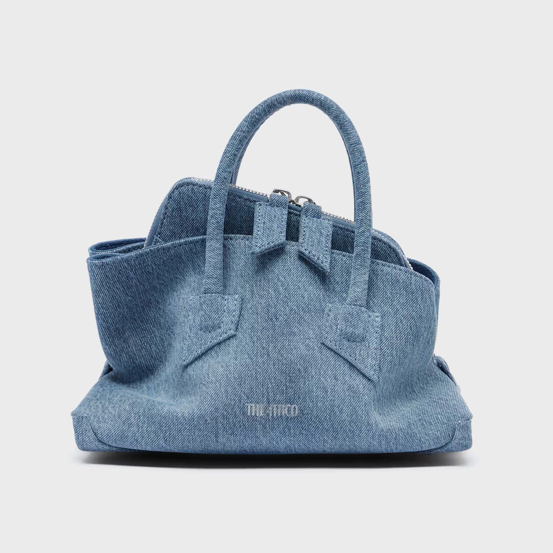 The Attico La Passeggiata mini top handle bag in washed denim, dual handles and zip top, front view