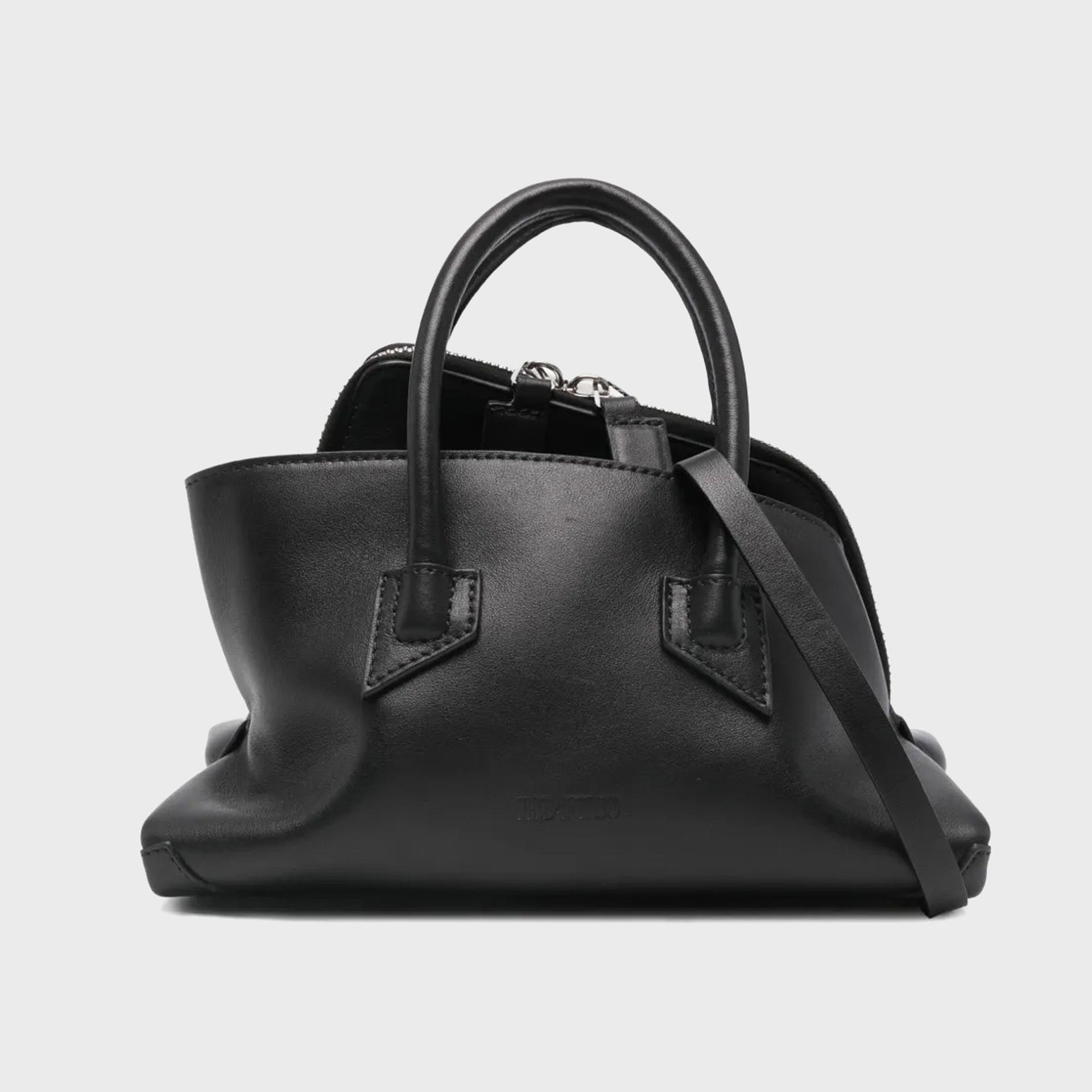 The Attico La Passeggiata mini top handle bag in black leather, dual rolled handles and zip top, front view