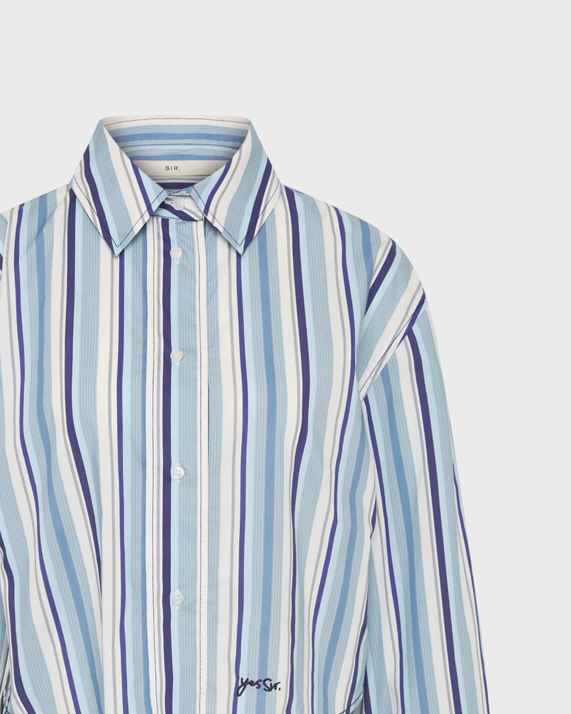 SIR the Label blue and white striped button-up shirt with 'Yes Sir' embroidery, close-up on collar and placket