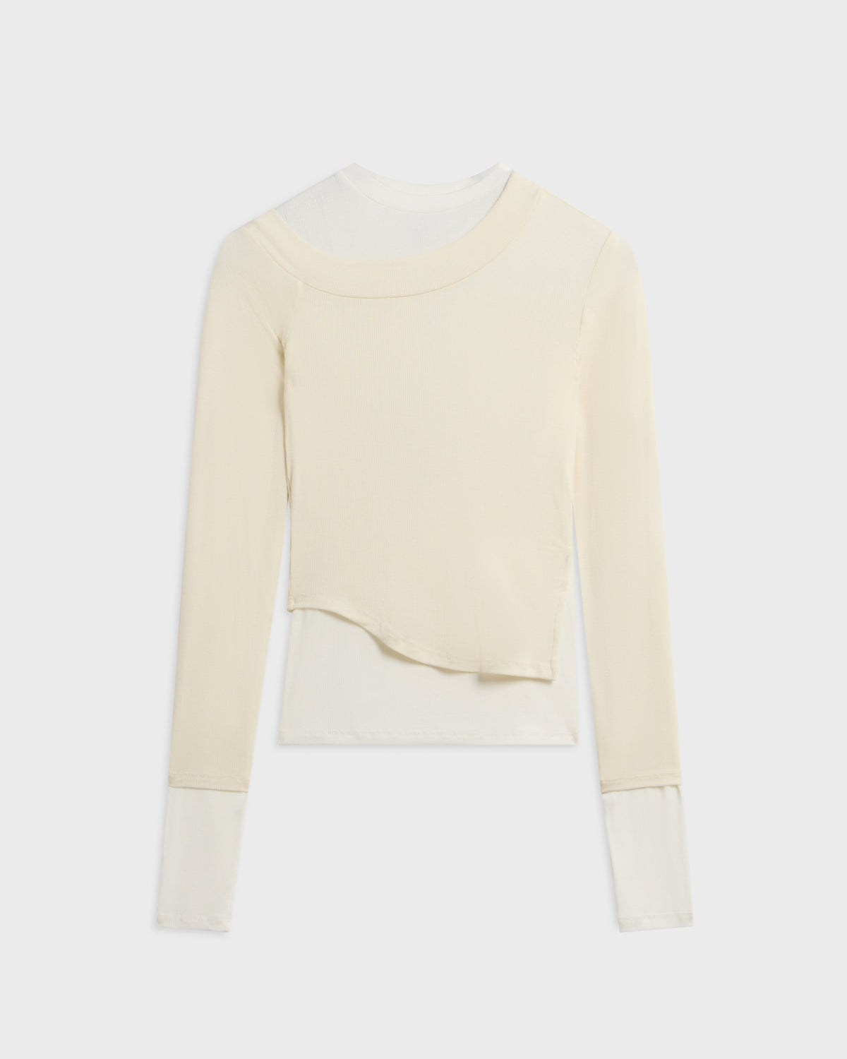 The Line By K cream asymmetric layered knit top with sheer white undershirt and long sleeves, front view