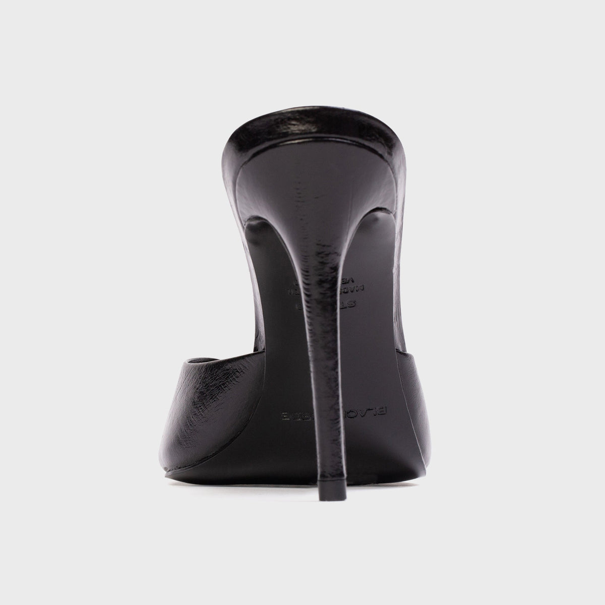 Black Suede Studio Brea Mule in Black Eel (black embossed leather), rear view of stiletto heel and heel cup