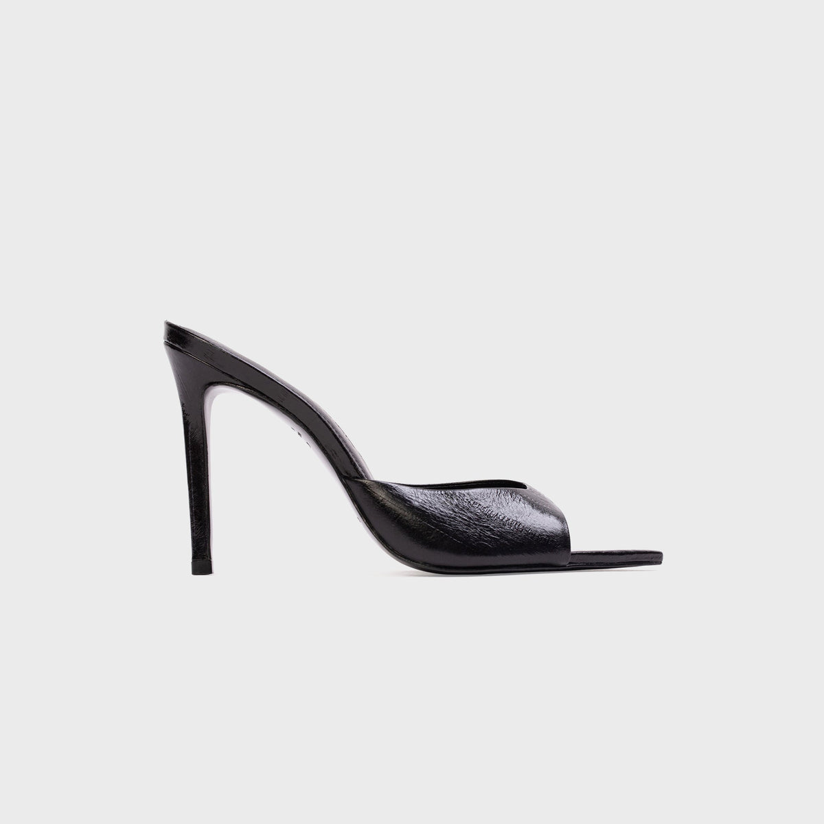 Black Suede Studio Brea Mule in Black Eel (black embossed leather), side profile with pointed toe and stiletto heel