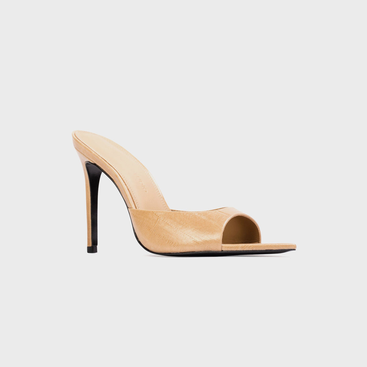 Black Suede Studio Brea Mule in Latte Eel (tan embossed leather), three-quarter view with stiletto heel and open toe