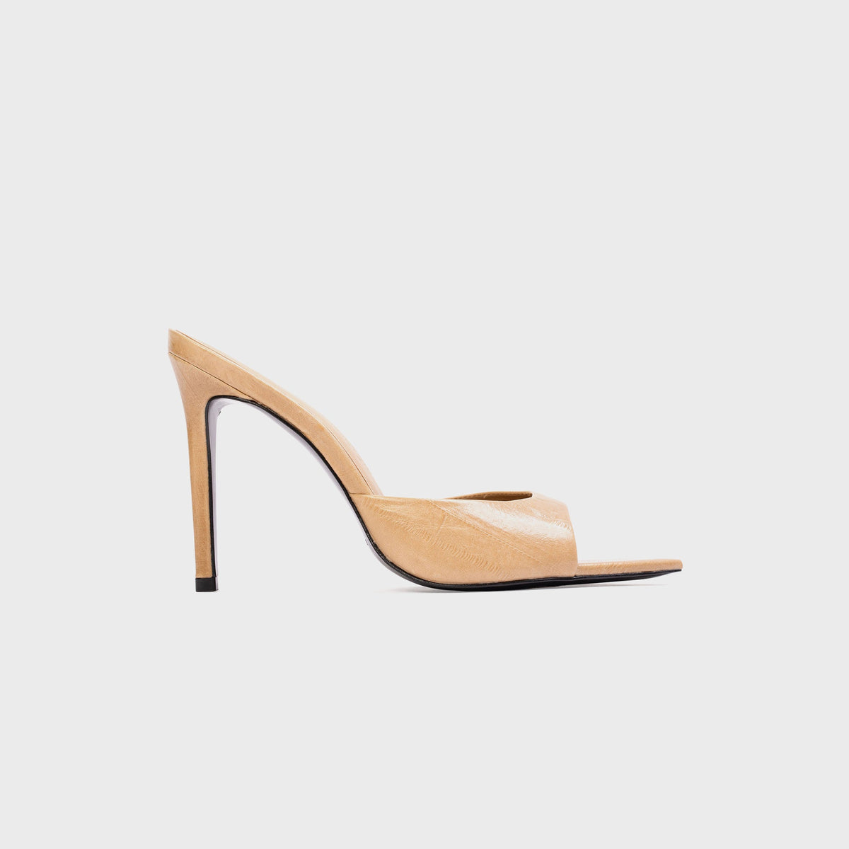 Black Suede Studio Brea Mule in Latte Eel (tan embossed leather), side profile with pointed toe and stiletto heel