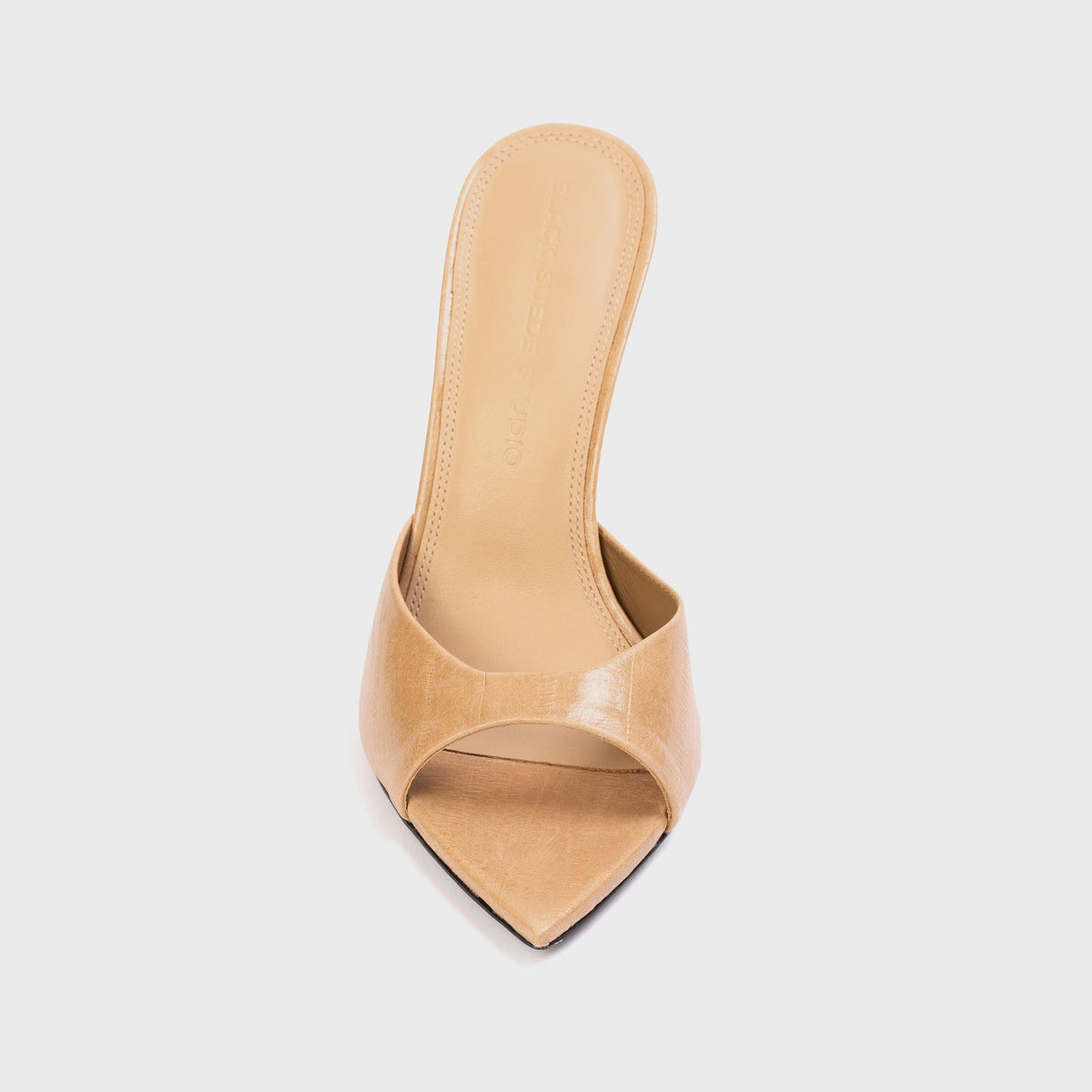 Black Suede Studio Brea Mule in Latte Eel (tan embossed leather), front view of pointed open toe and tan footbed