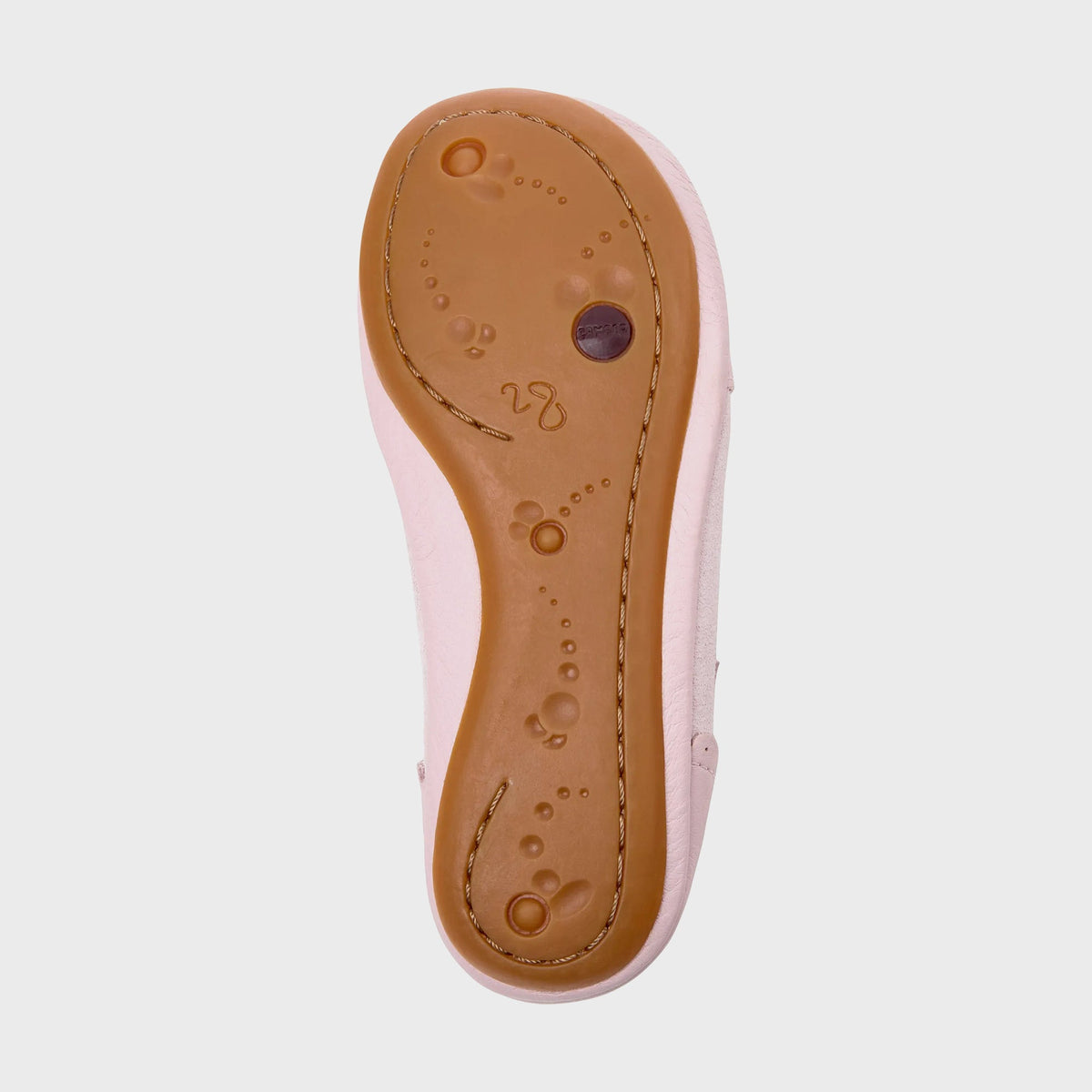 Camper Kids pink Mary Jane flat, sole view showing tan rubber outsole with embossed foot motif and logo