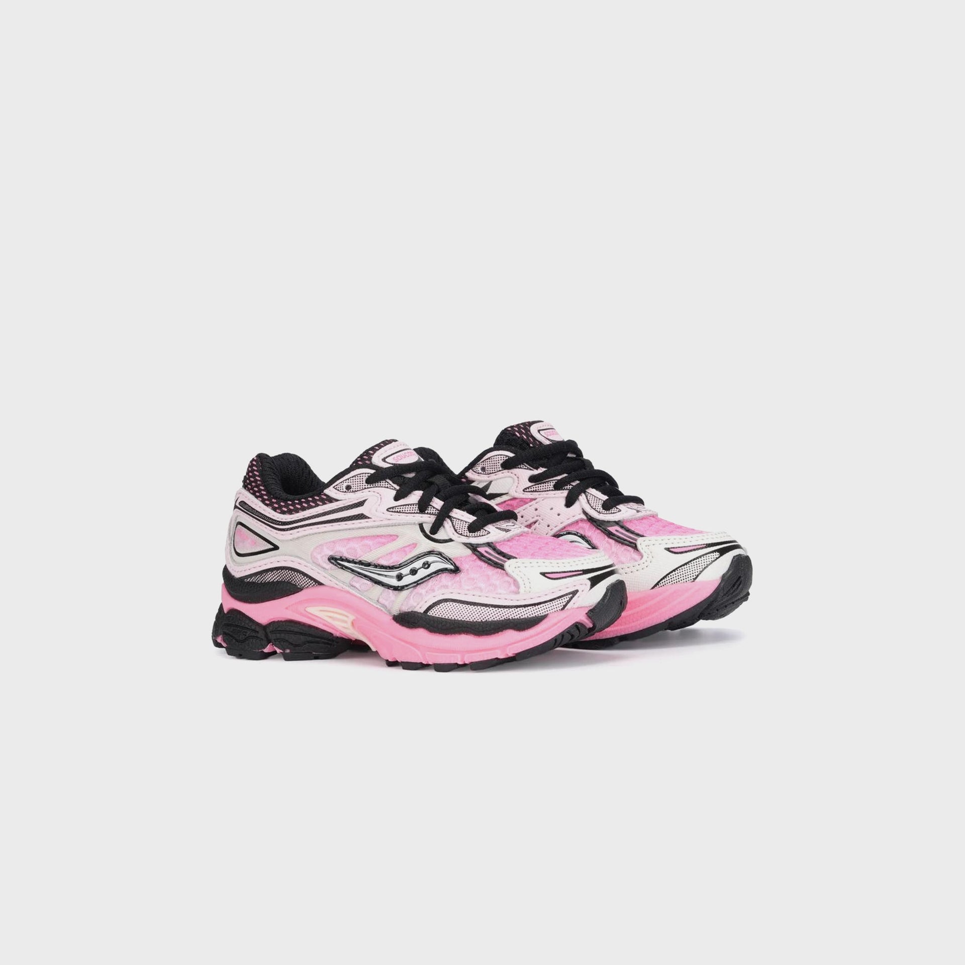 Saucony TD Omni 9 KDZ sneaker pair in pink and white, three-quarter front view