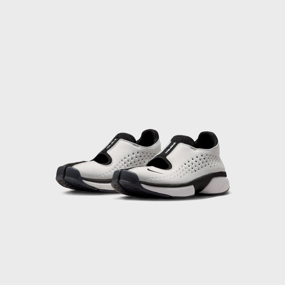 Nike Rift 2 split-toe sneakers in Black and Metallic Silver, front three-quarter view of the pair
