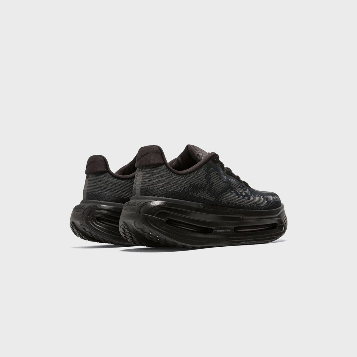 Nike Vomero Premium SP in Black / Iron Grey, rear three-quarter view of heel pull tab and air-window midsole