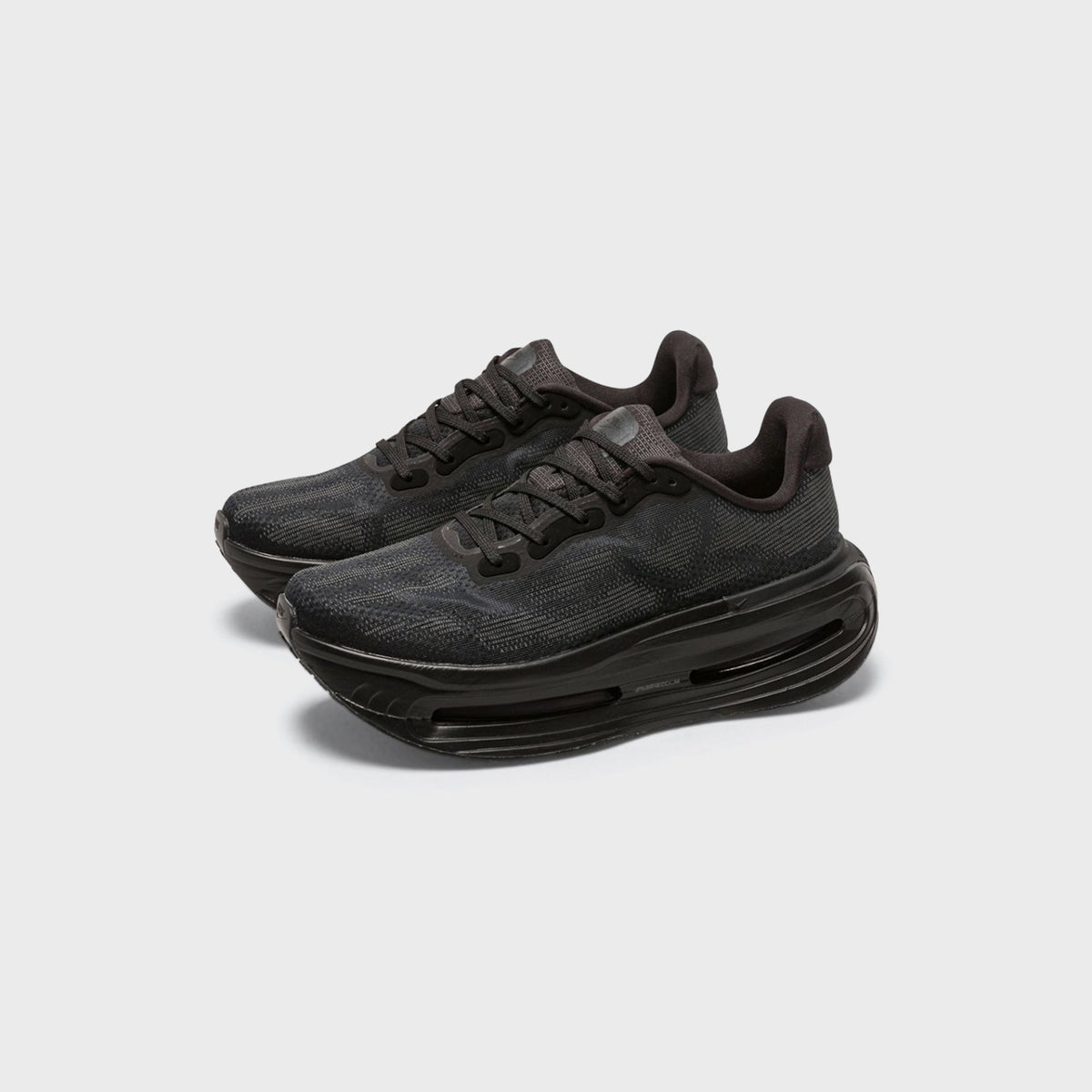 Pair of Nike Vomero Premium SP sneakers in Black / Iron Grey, front three-quarter view with thick sculpted midsoles