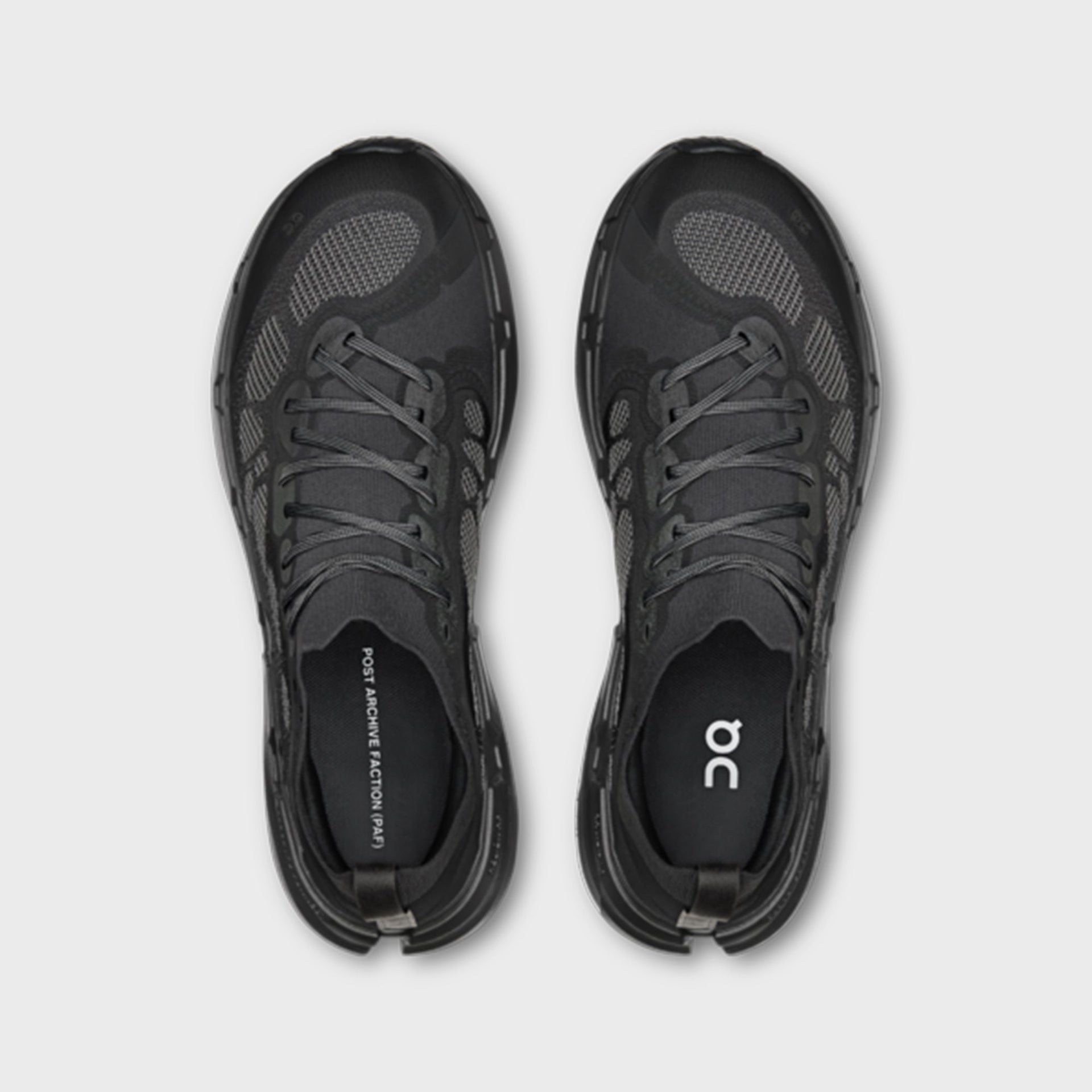 On x Post Archive Faction Cloudsoma sneaker in all-black, top-down view of pair