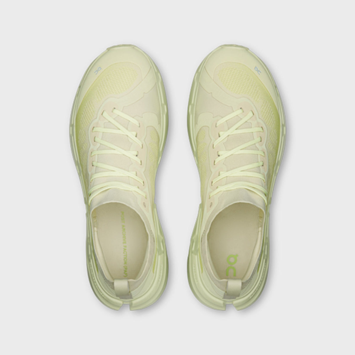 On x Post Archive Faction Cloudsoma sneaker in pale lime green, top-down view of pair