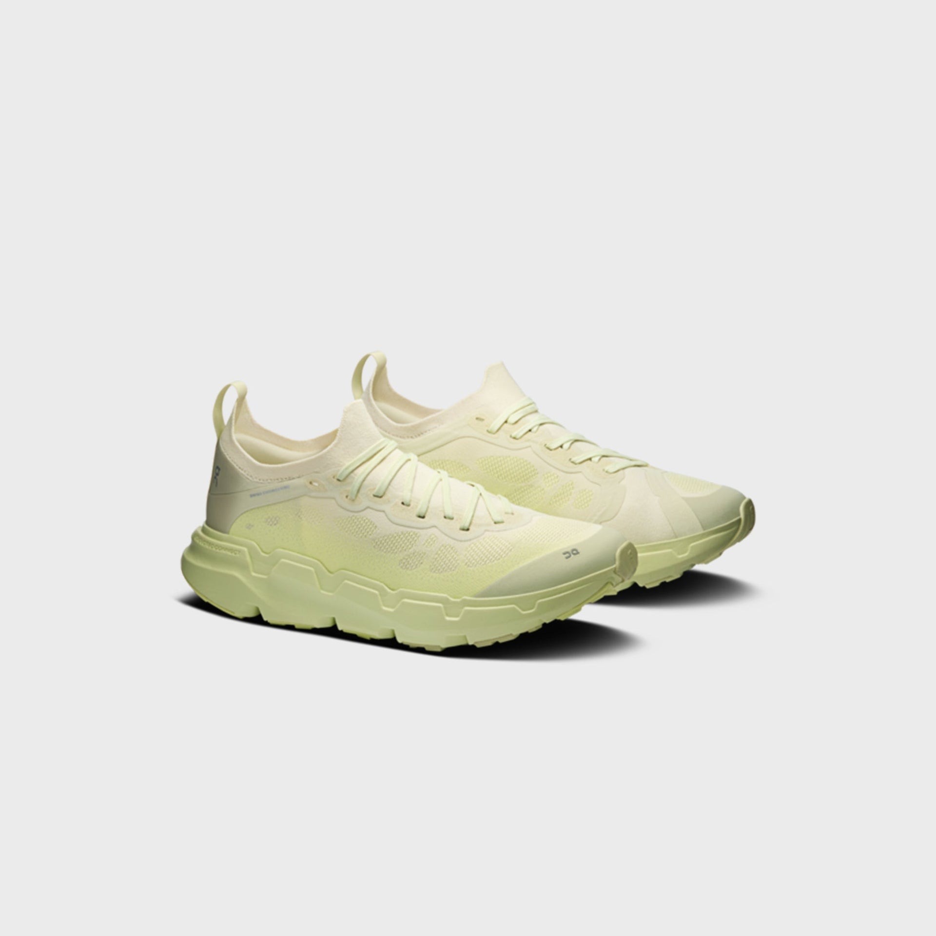 On x Post Archive Faction Cloudsoma sneaker in pale lime green, front three-quarter view of pair