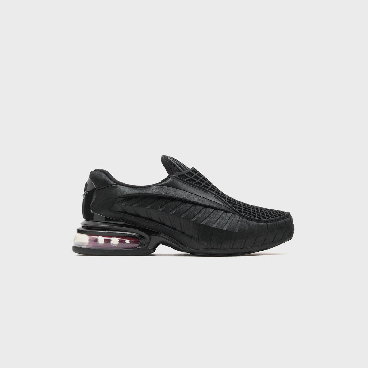 Nike WMNS Air Max Dolce Black / Sport Red slip-on sneaker, side view with black grid mesh upper and pink-tinted Air heel unit
