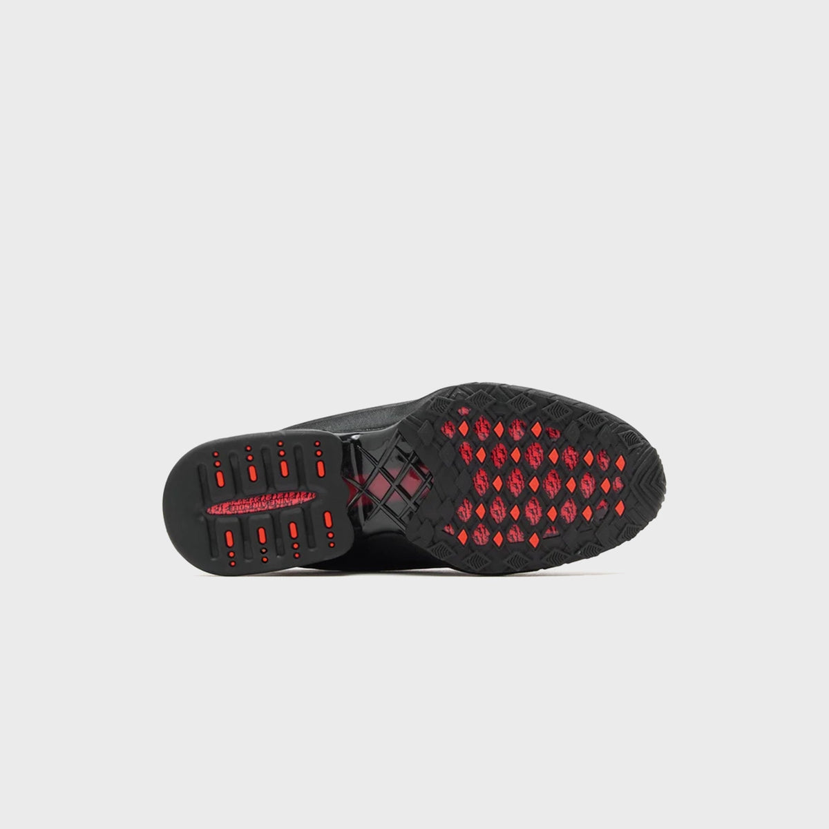 Nike WMNS Air Max Dolce Black / Sport Red outsole view with black rubber and bright red diamond traction pattern